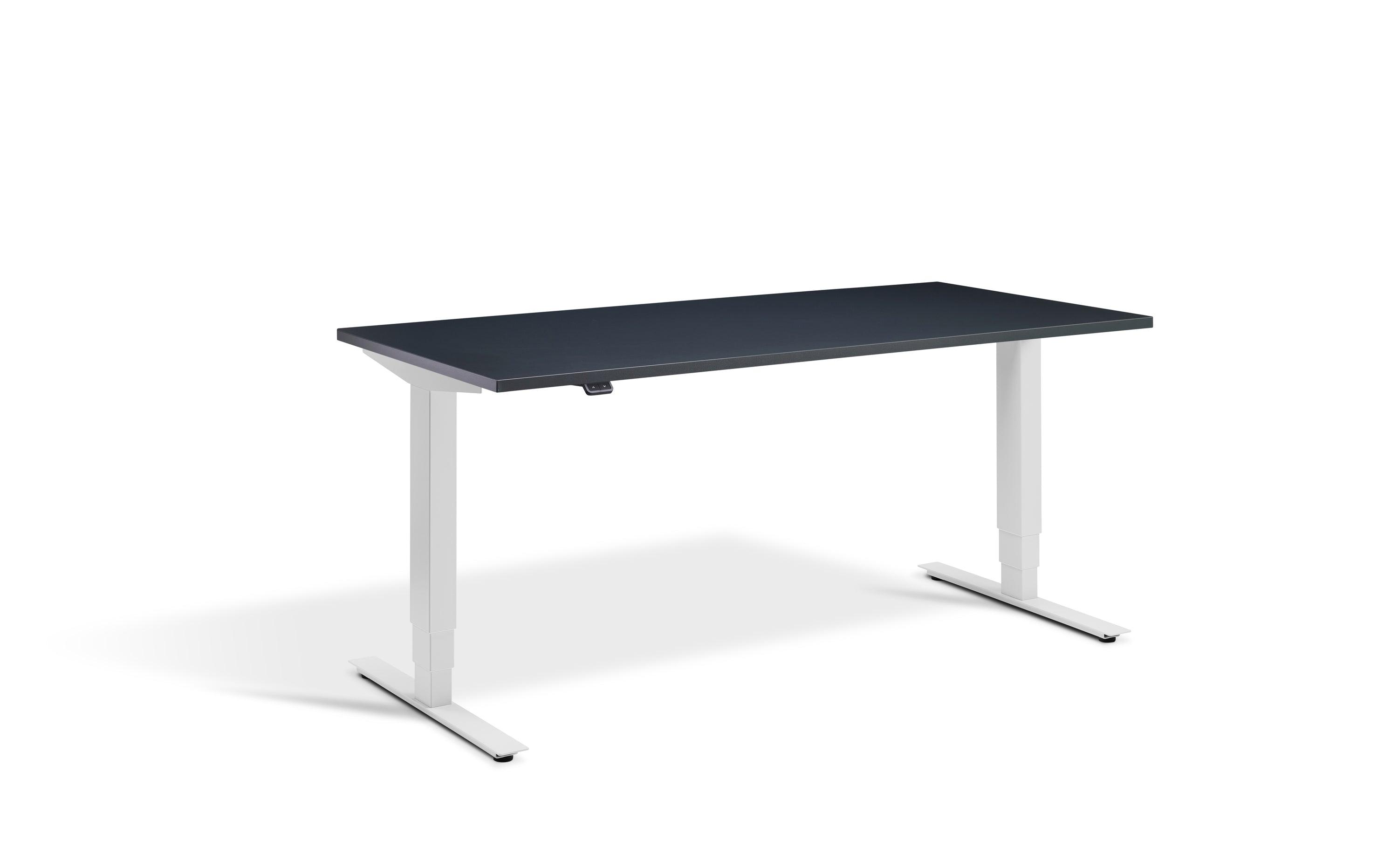 a desk with a black top and white legs