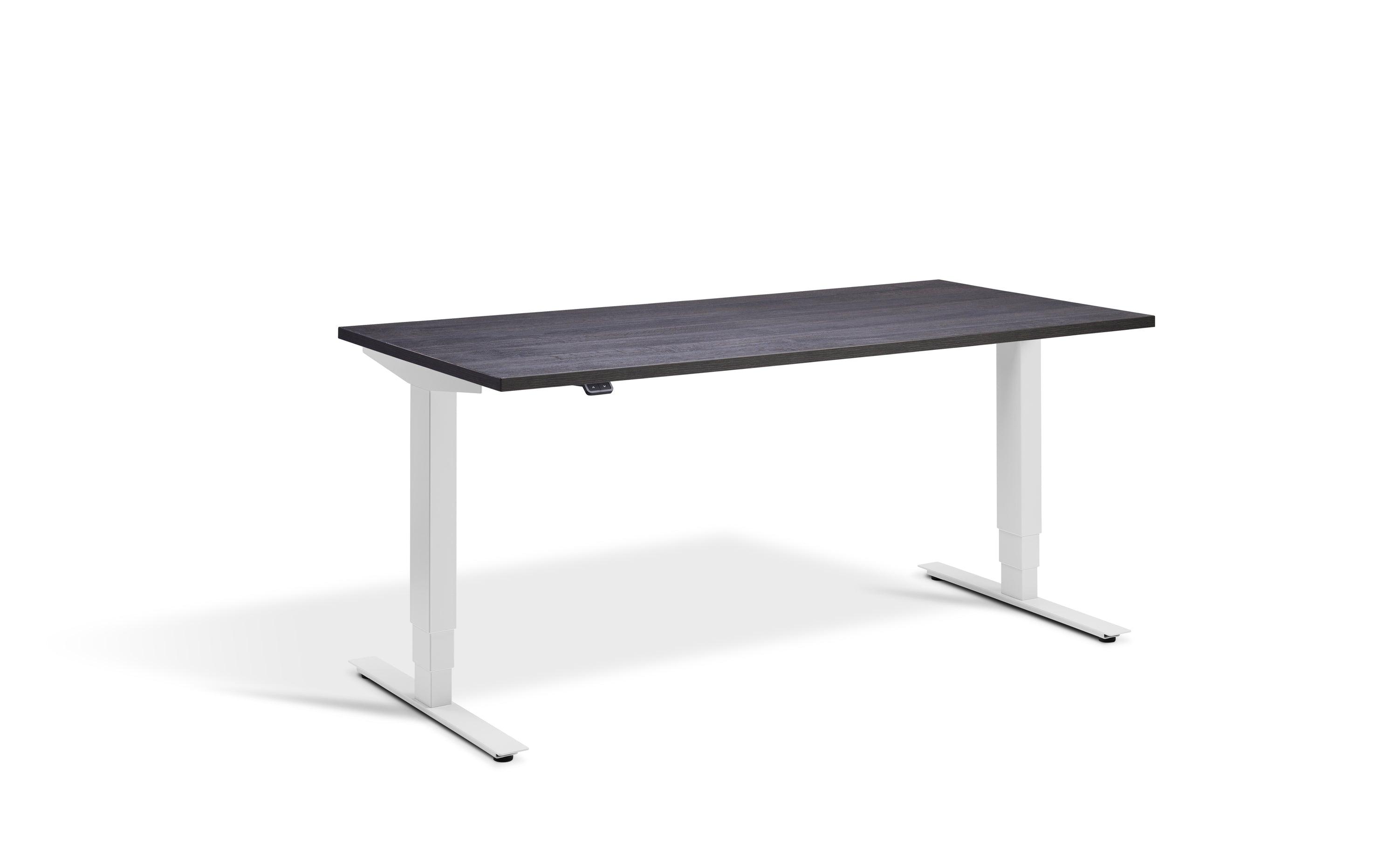 a desk with a black top and white legs