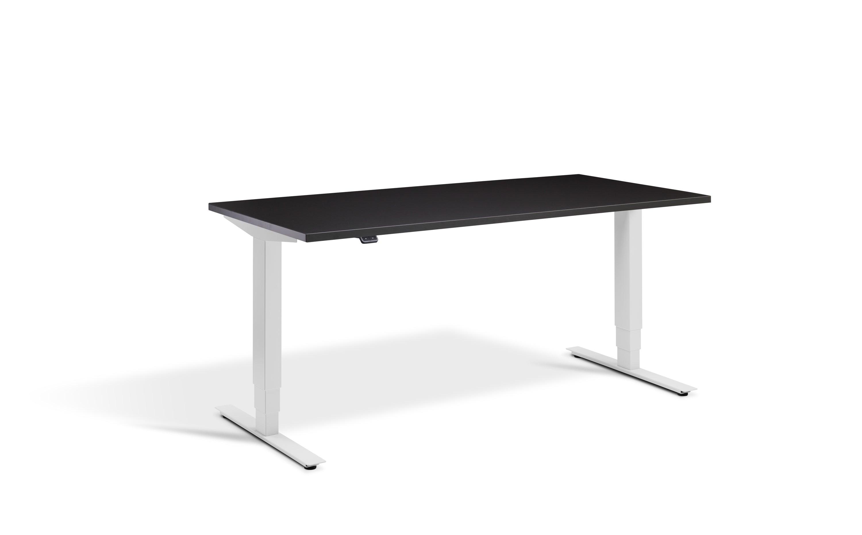 a desk with a black top and white legs