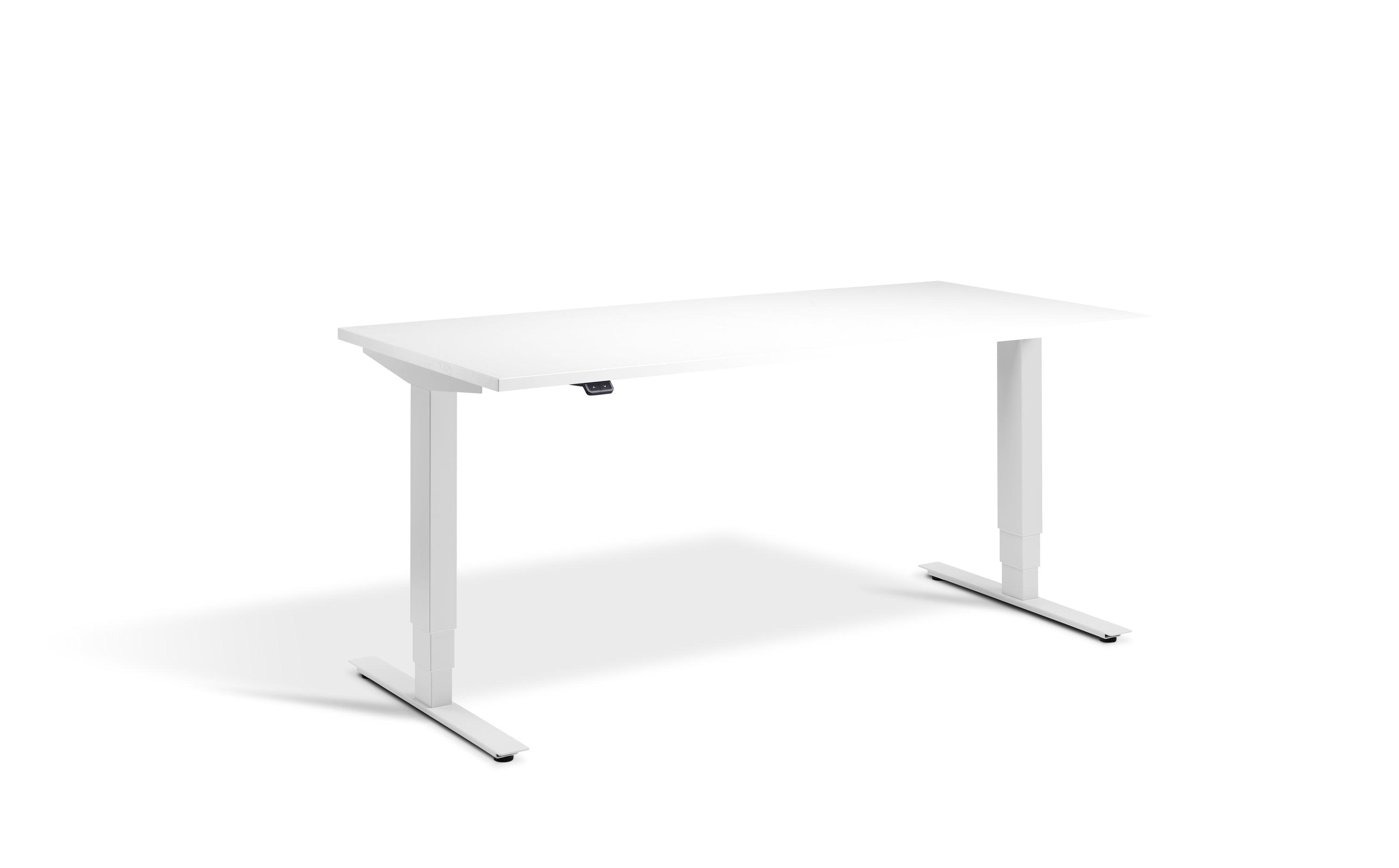 a white desk sitting on top of a white floor