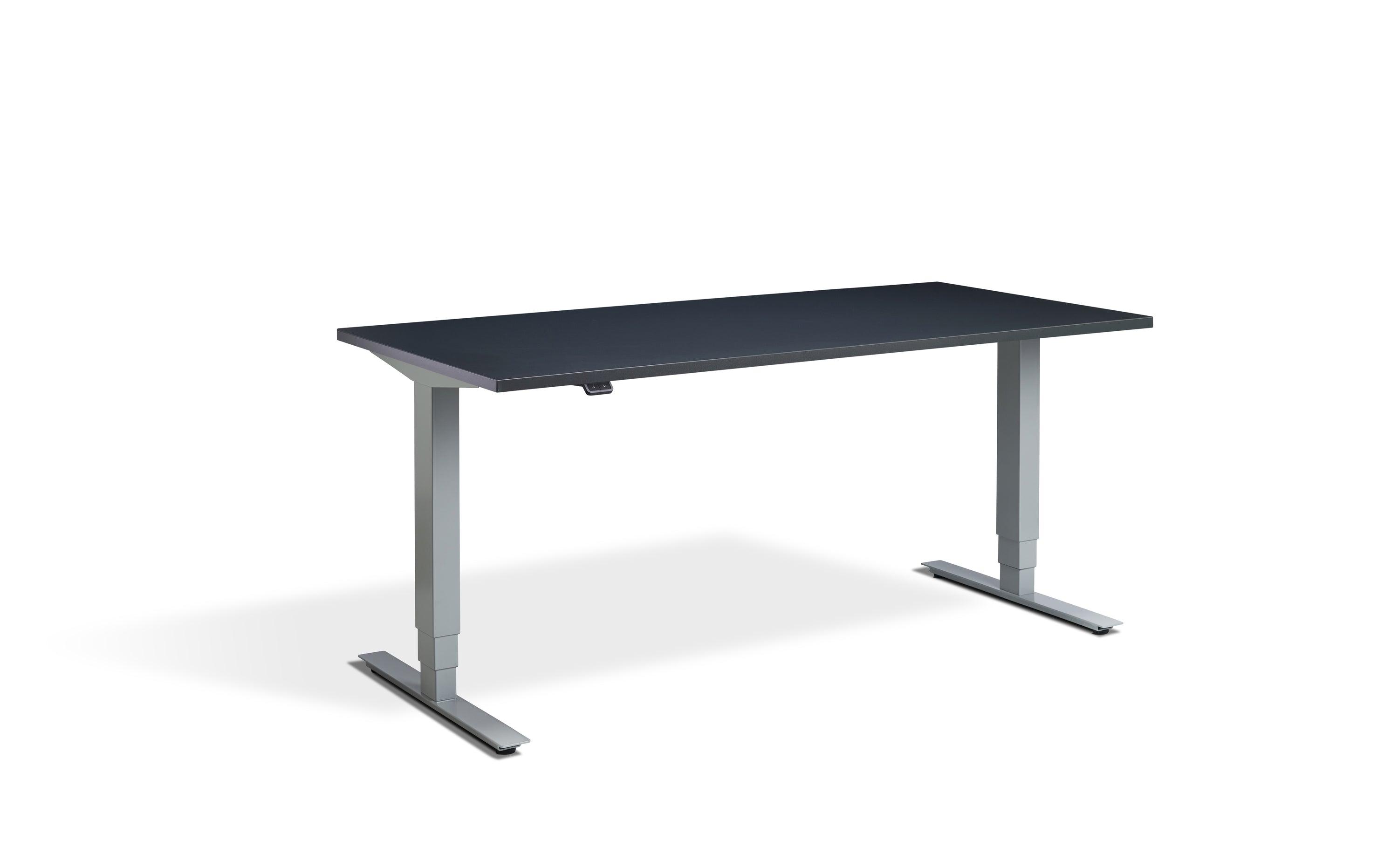 a desk with a black top and silver legs