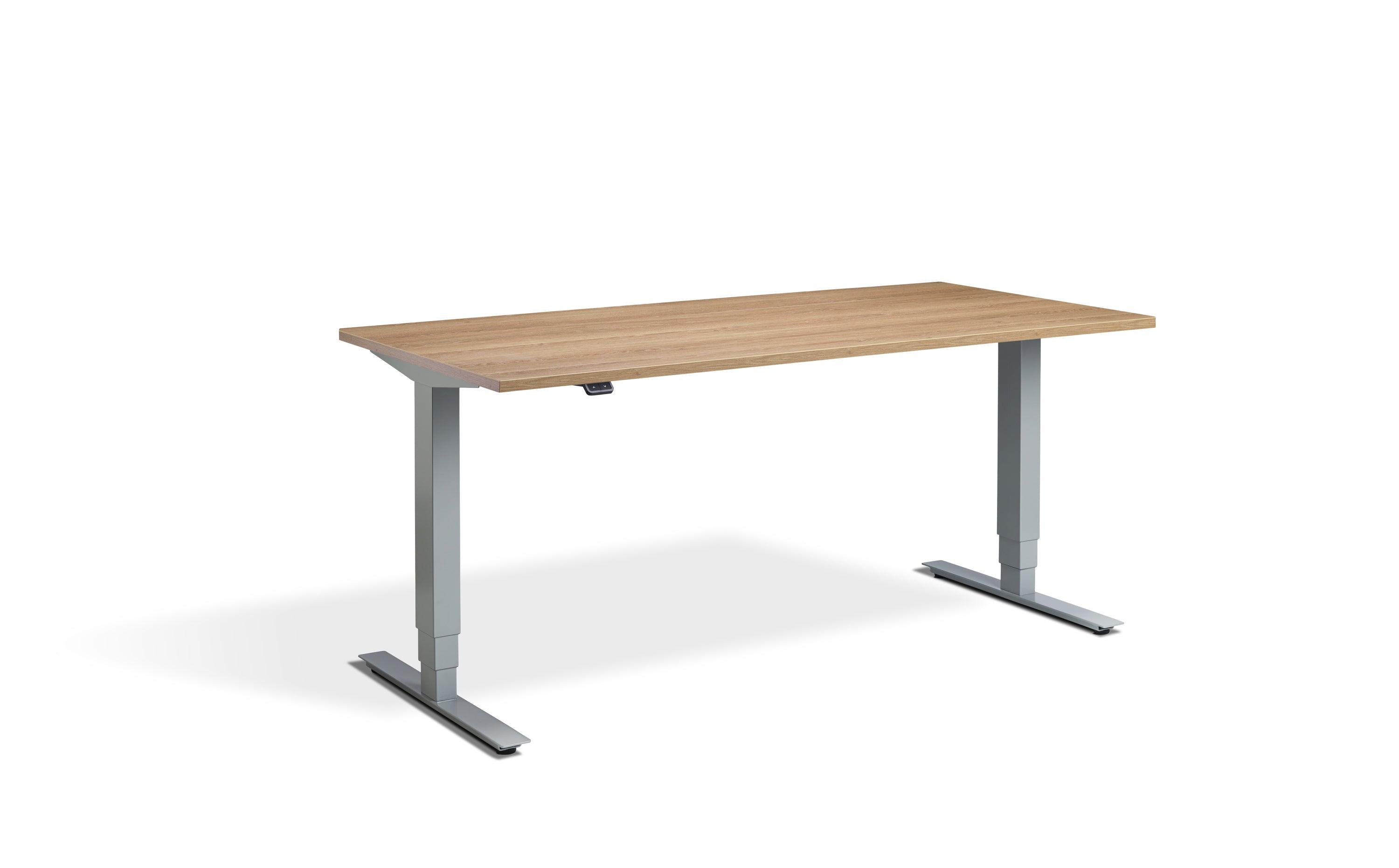 a wooden desk with metal legs on a white background