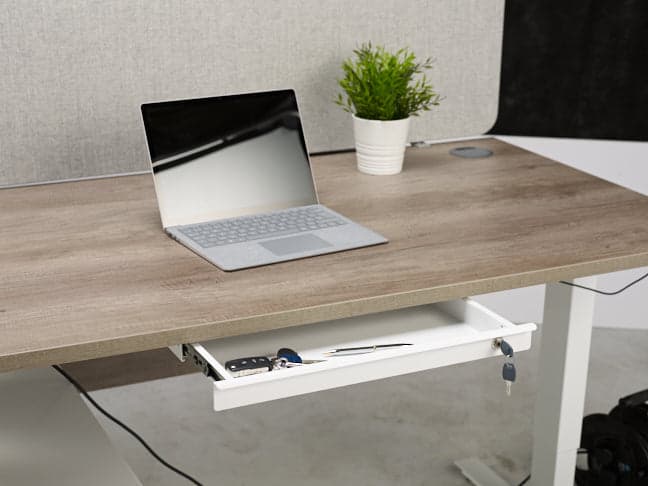 a laptop computer sitting on top of a wooden desk