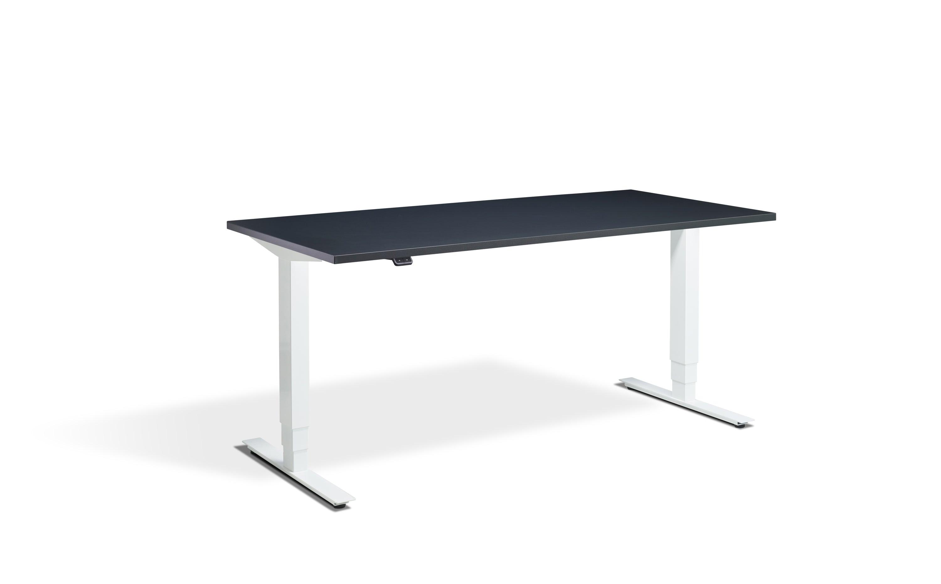 a desk with a black top and white legs