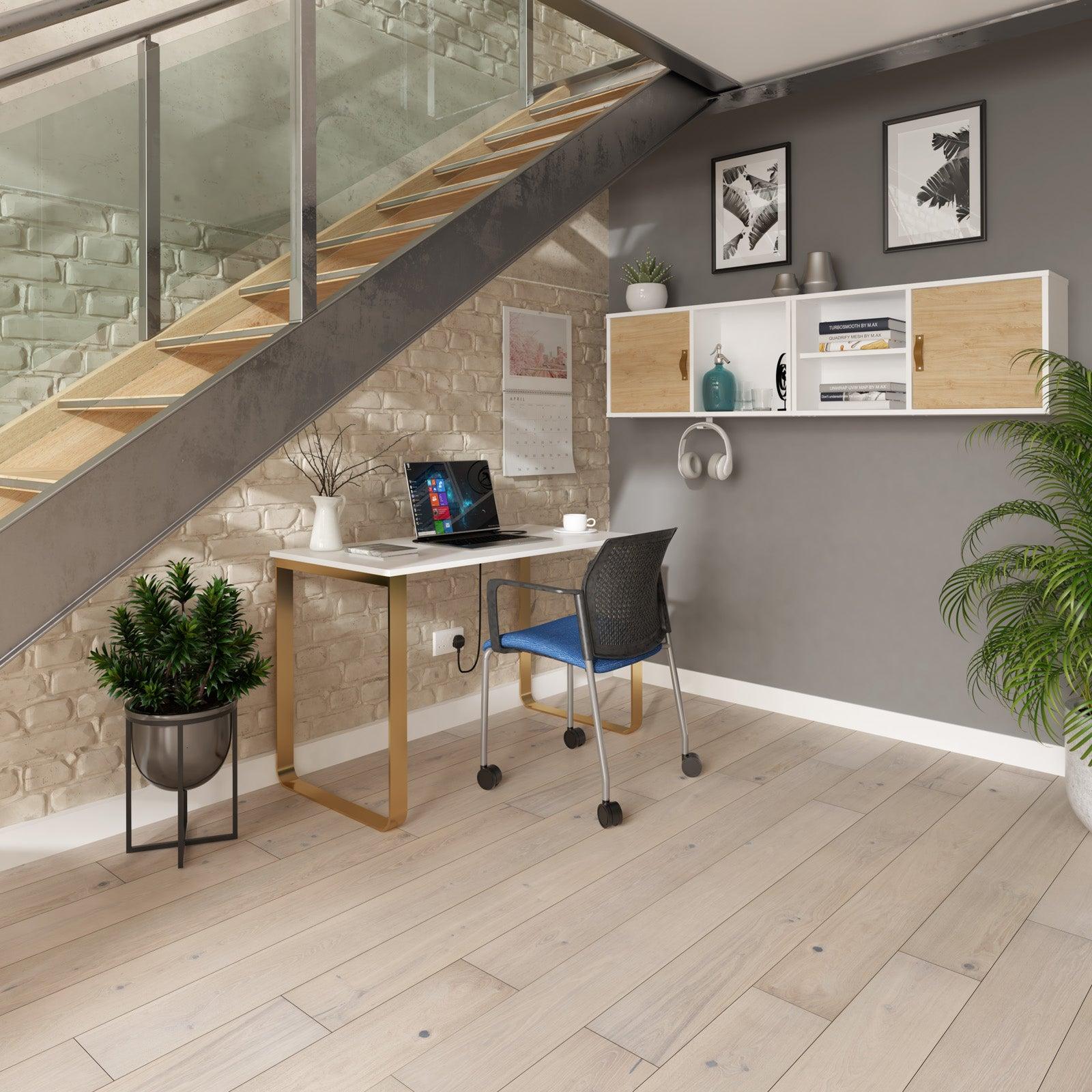 a room with a desk, chair, and stairs