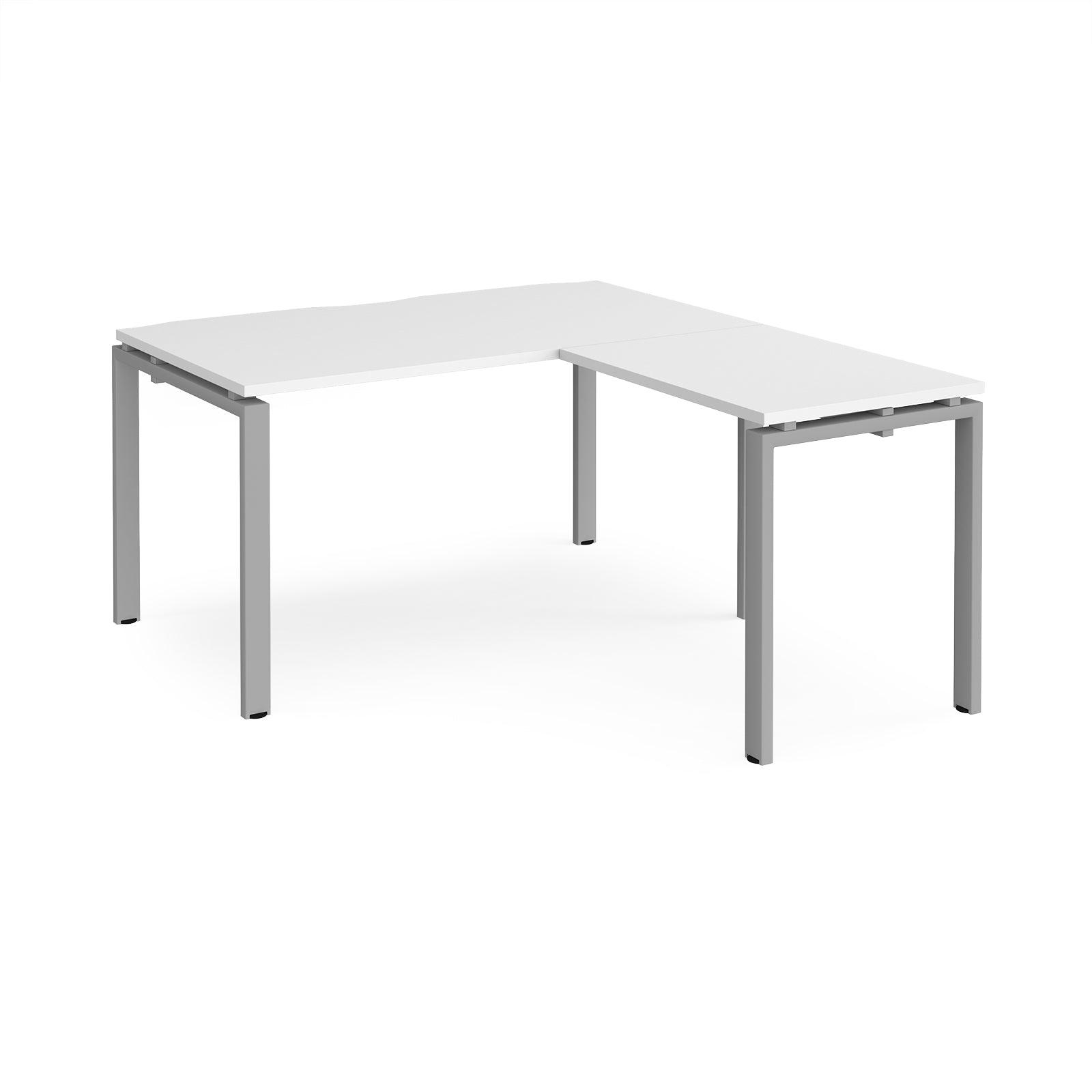 a white table with a silver frame on it