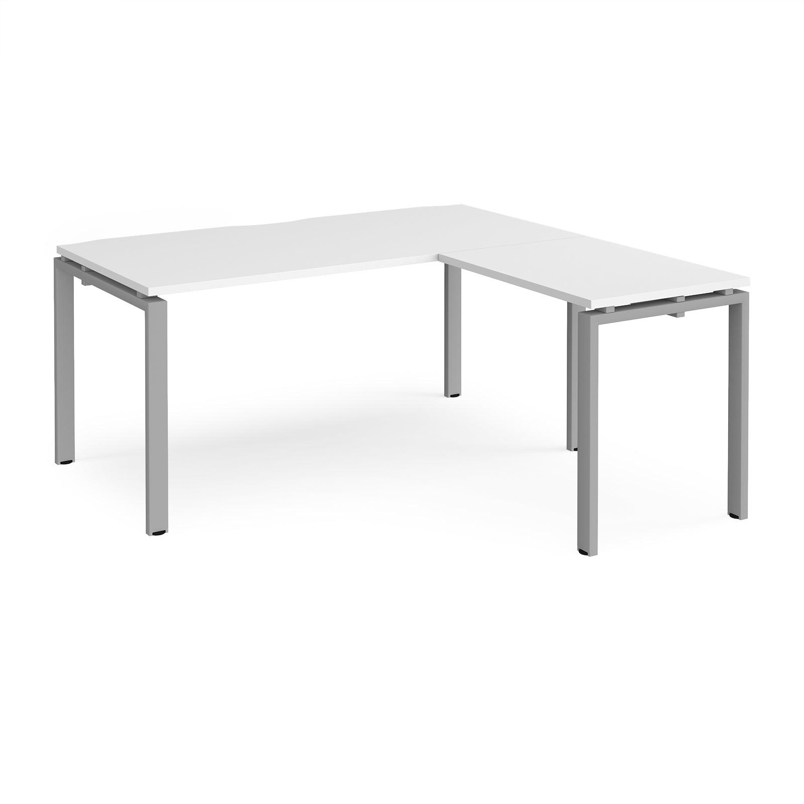 a white table with a silver frame on it