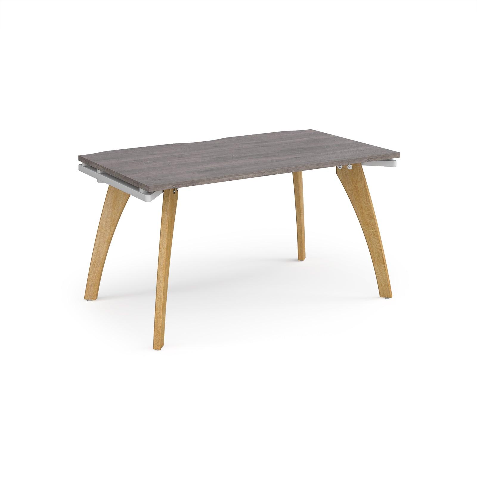 a wooden table with a grey top and wooden legs