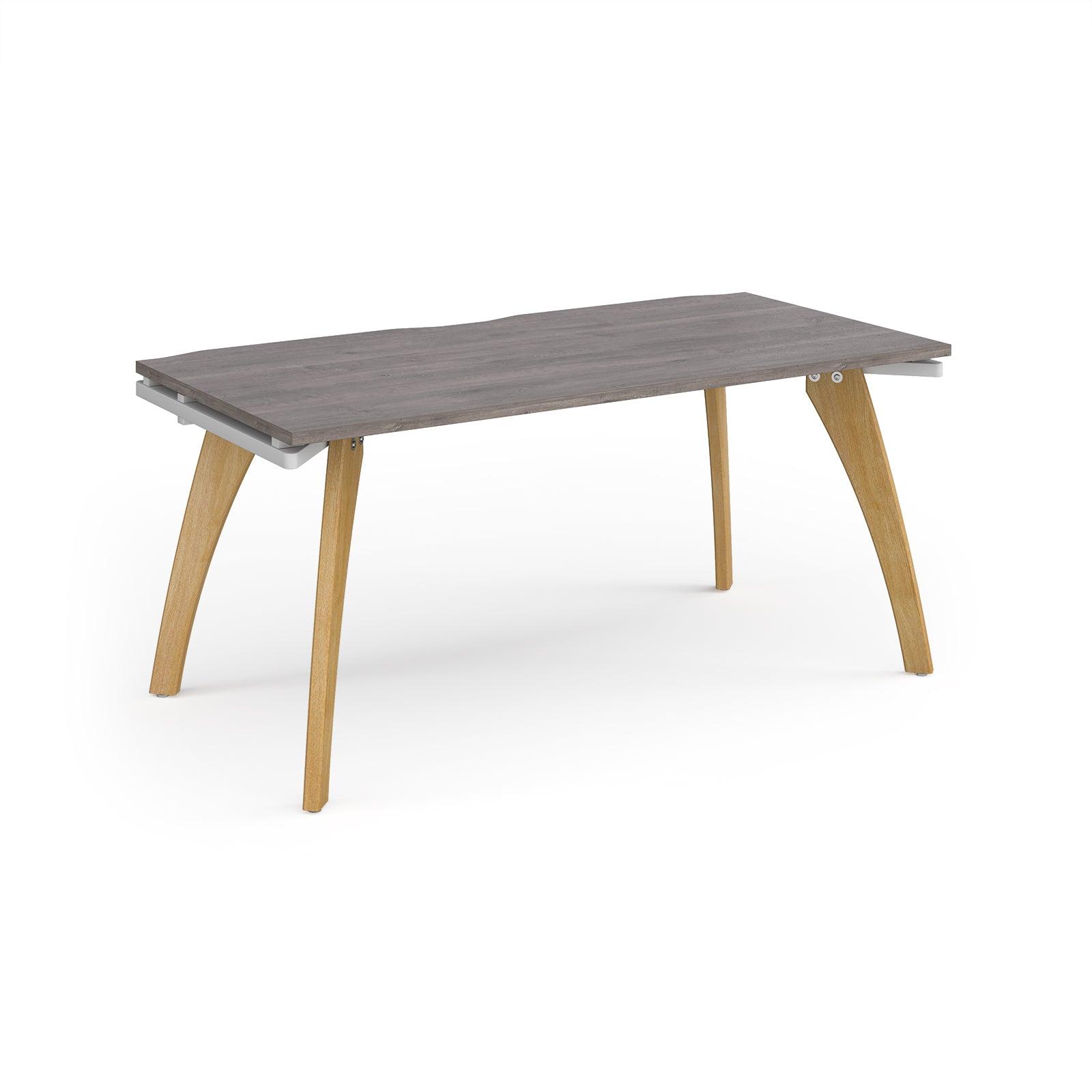 a wooden table with a grey top and wooden legs