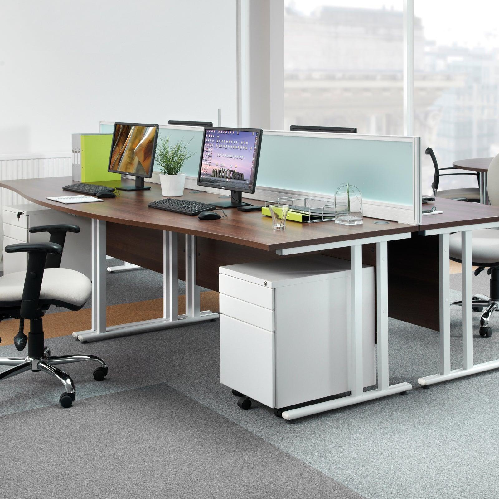 a desk with a laptop and a monitor on it