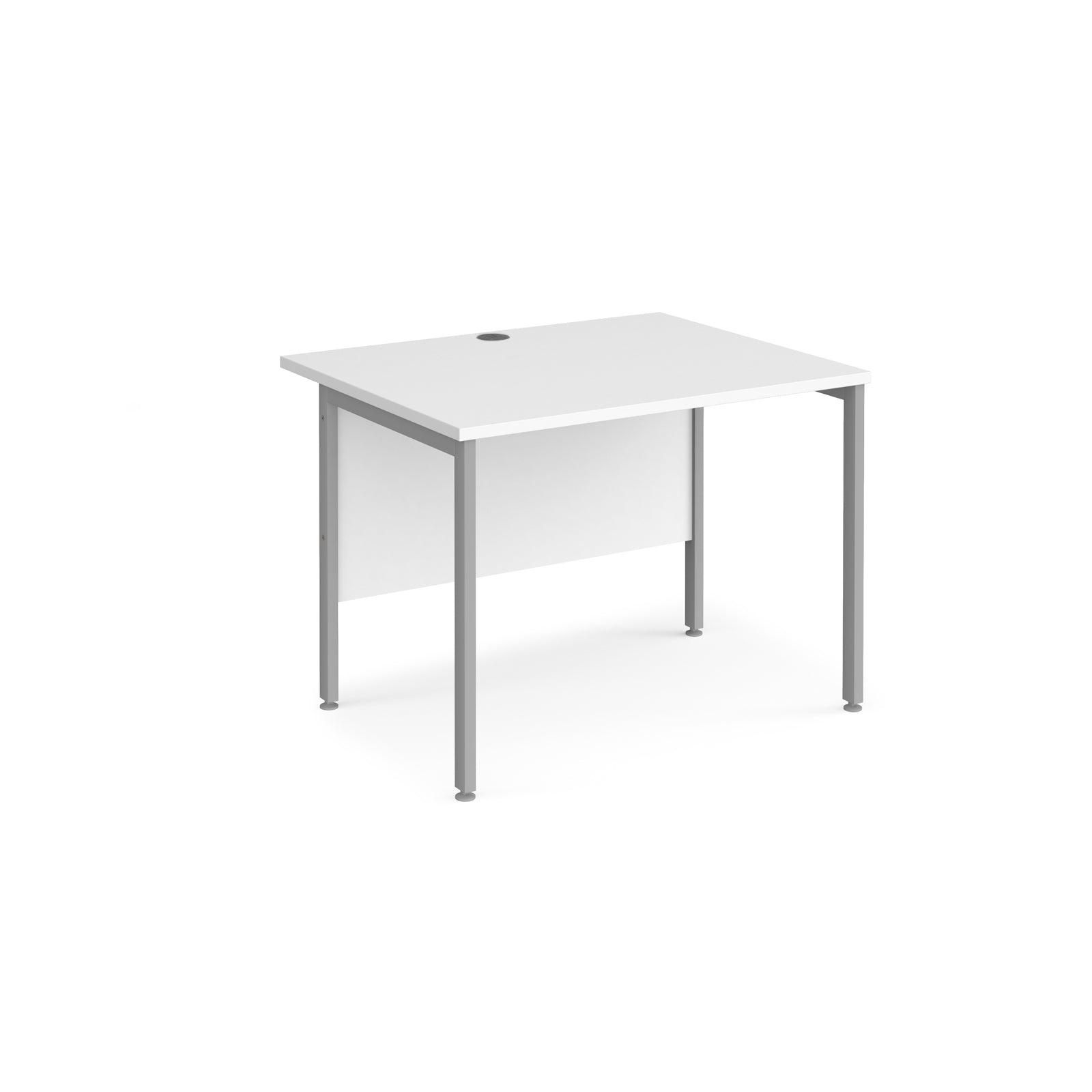 a desk with a white top and silver legs