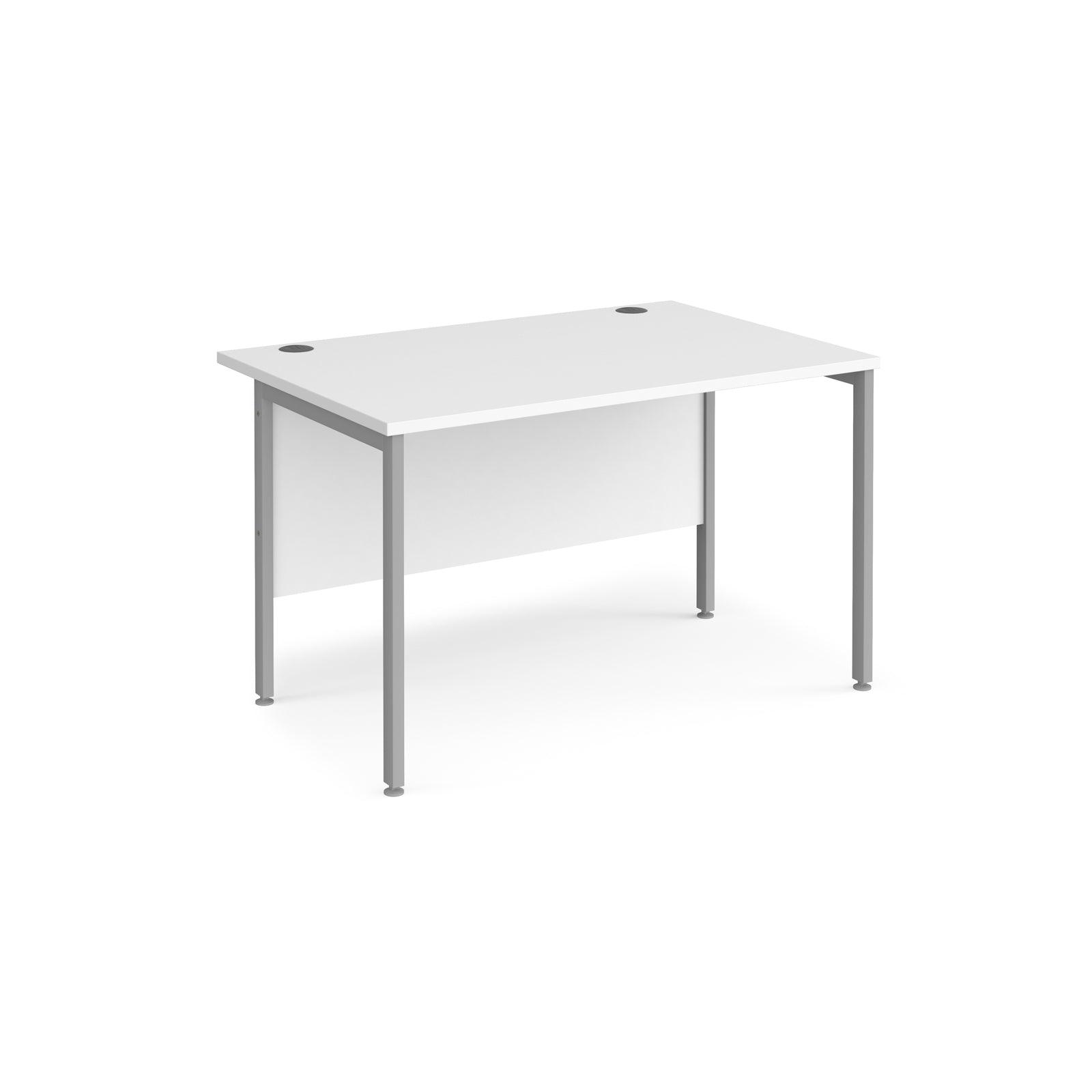 a white desk sitting on top of a white floor