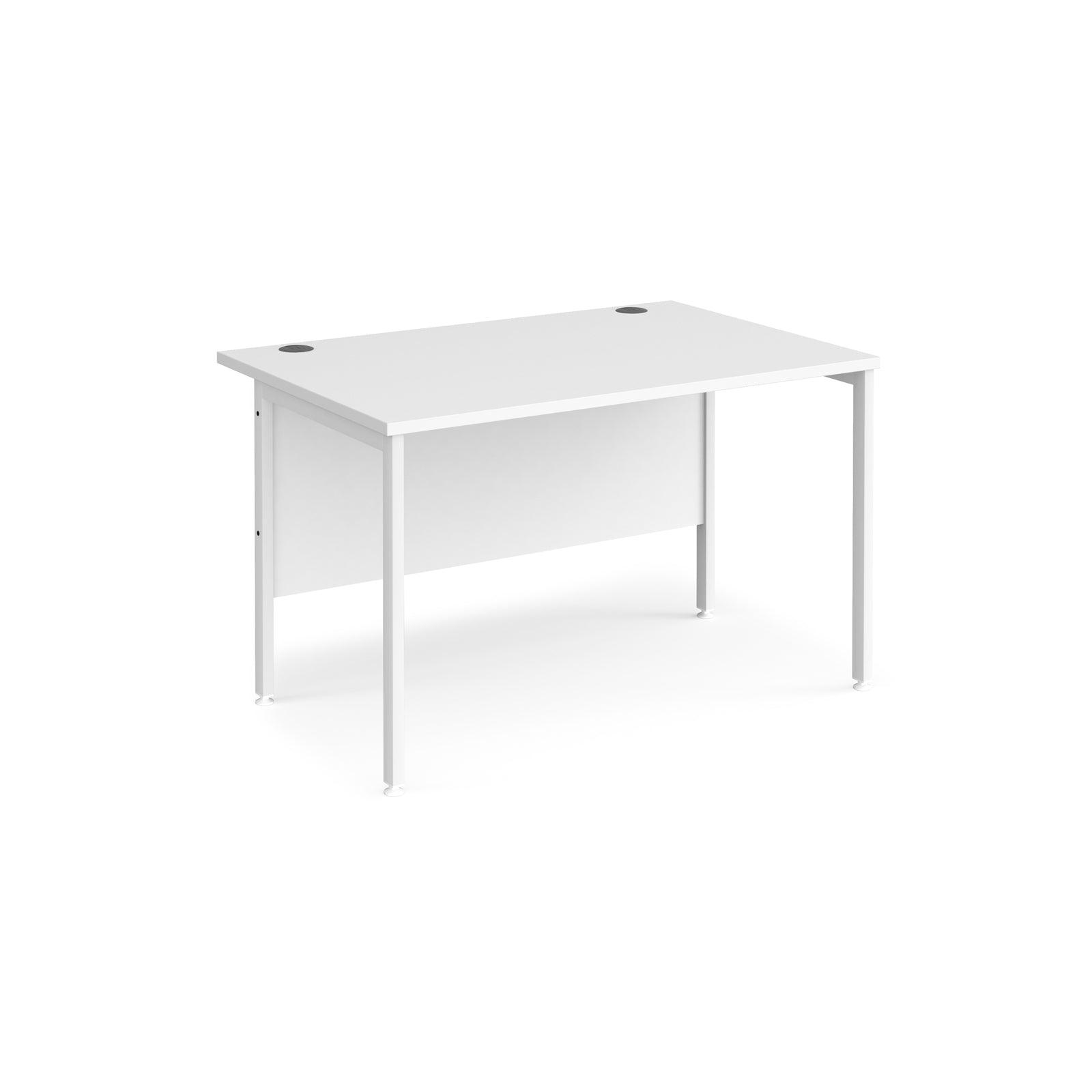 a white desk sitting on top of a white floor