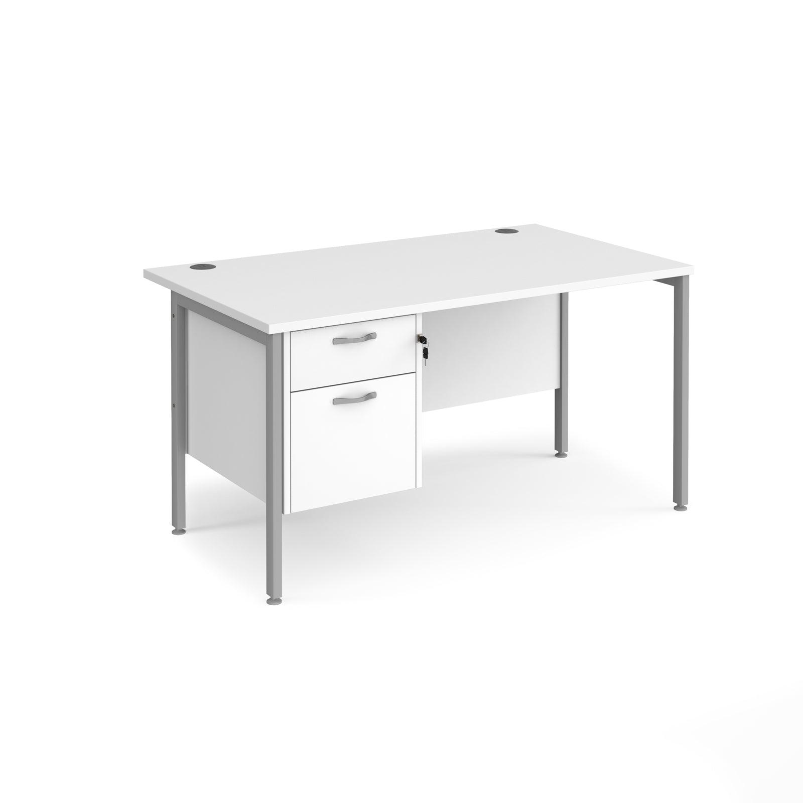 a white desk with a drawer underneath it