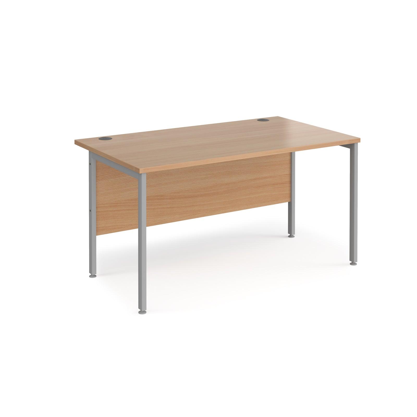 a wooden desk with metal legs on a white background