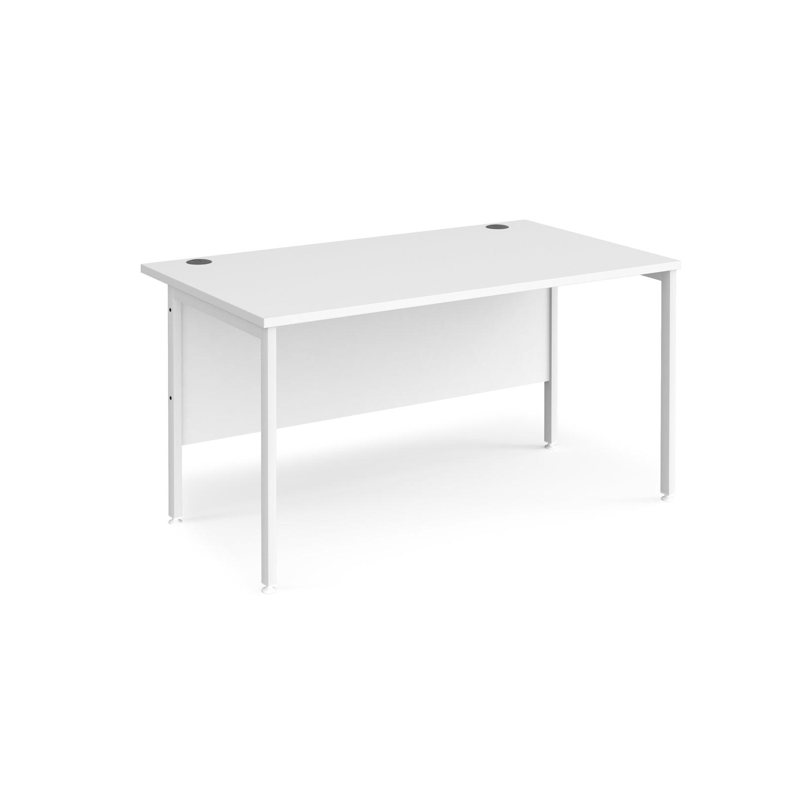 a white desk sitting on top of a white floor