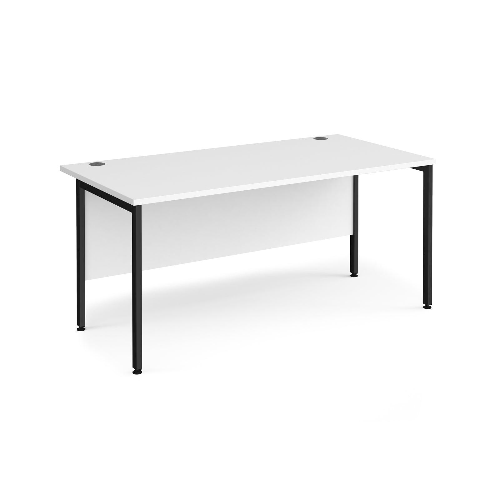 a white desk with black legs on a white background