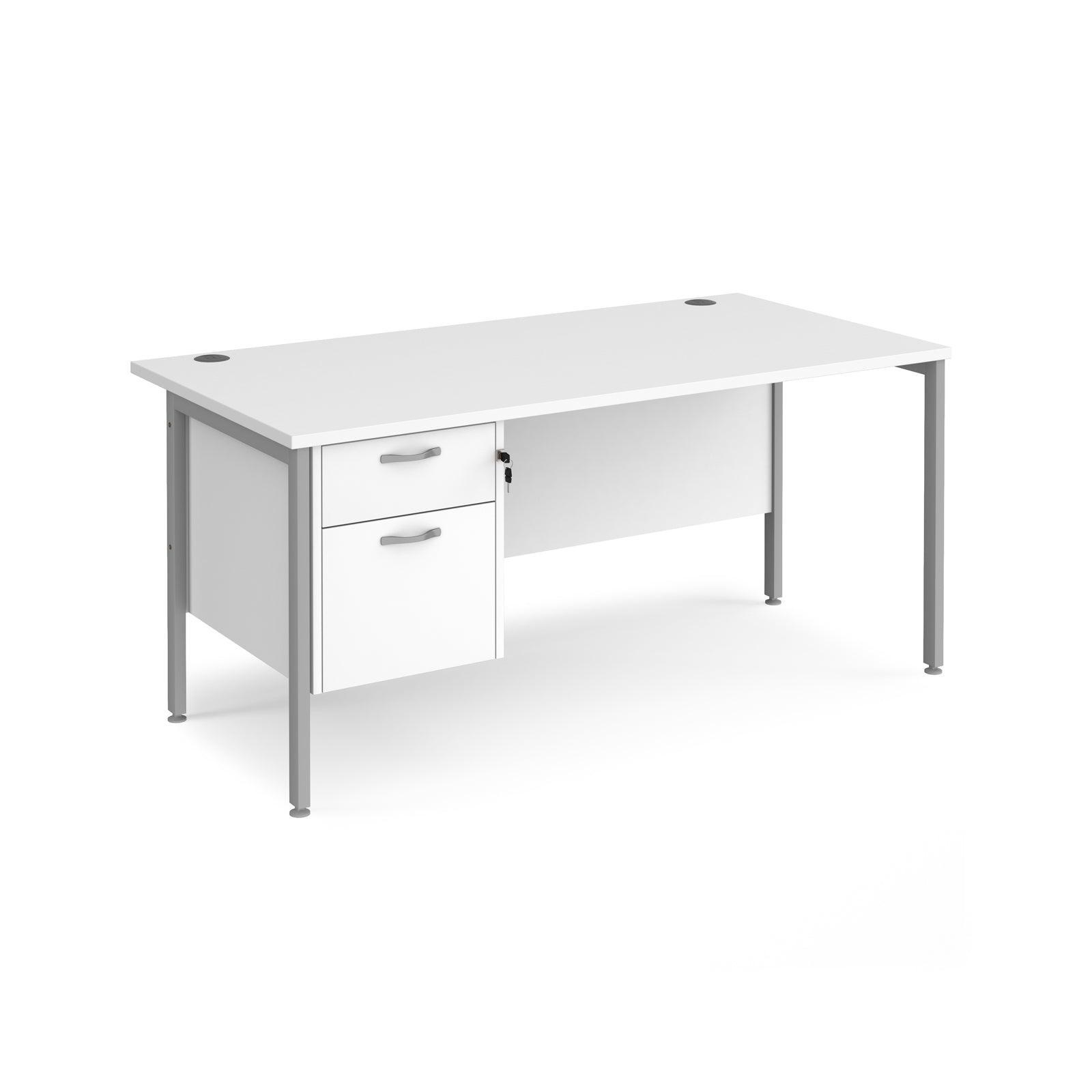 a white desk with a drawer underneath it