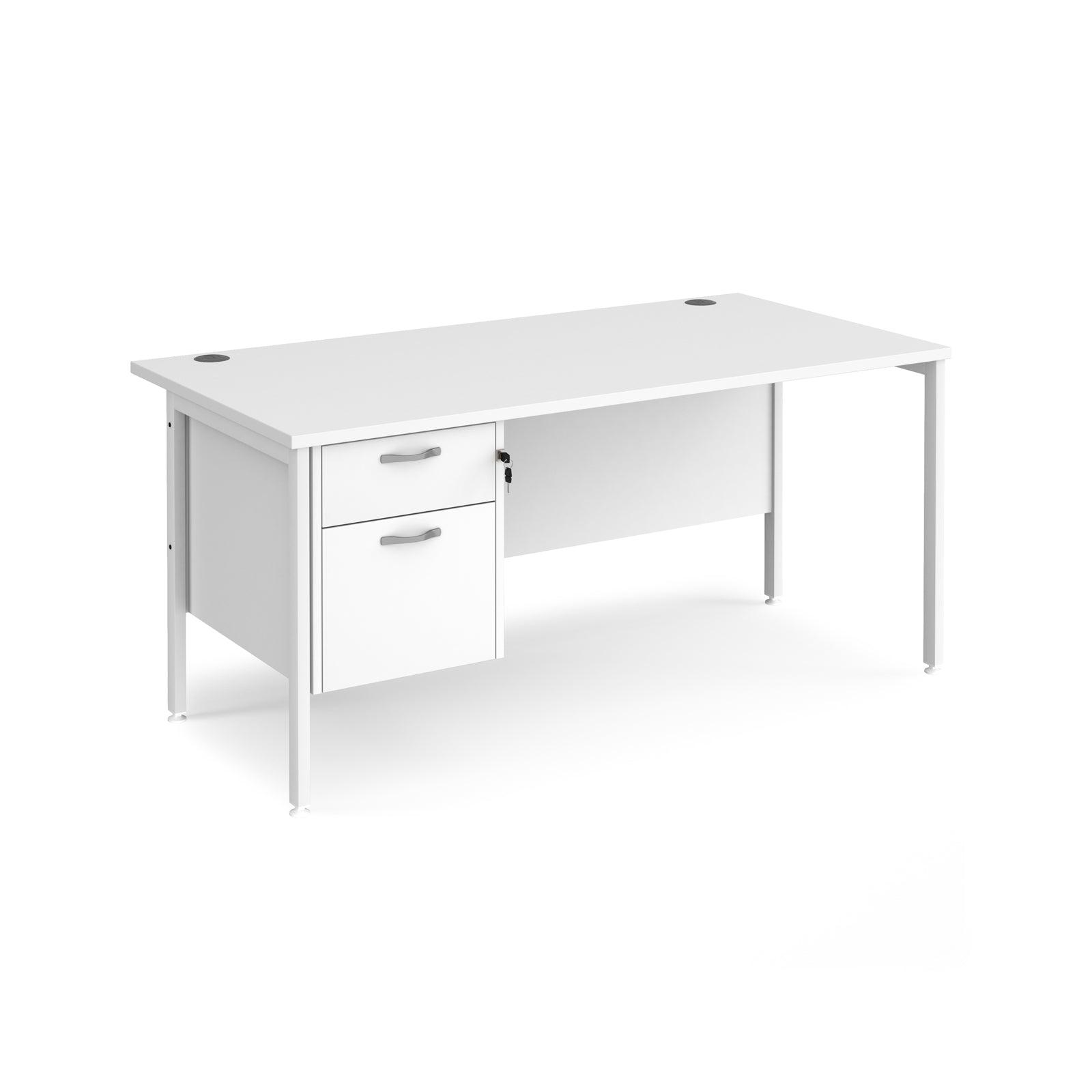 a white desk with a drawer underneath it