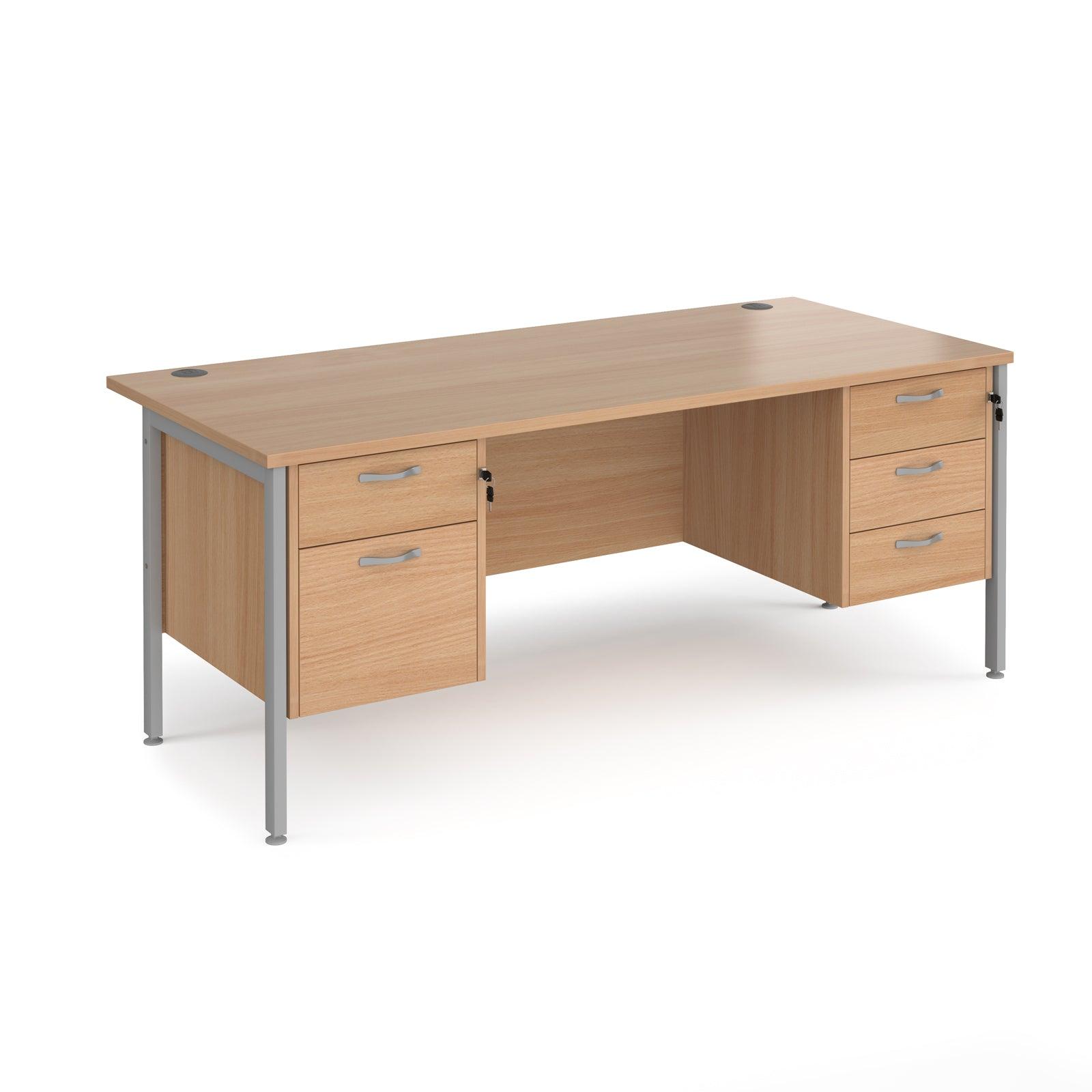 a wooden desk with two drawers and a metal frame