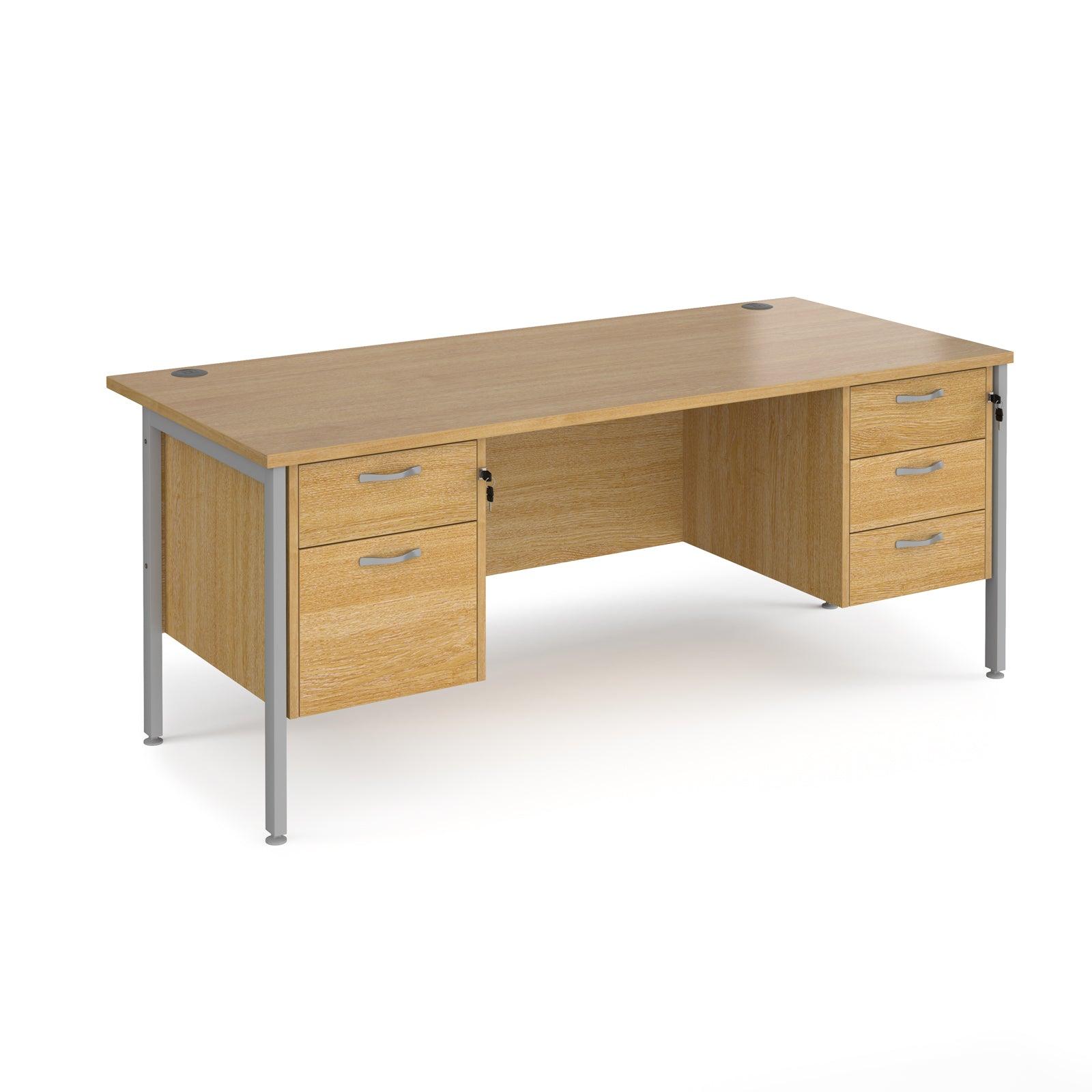 a wooden desk with two drawers and a metal frame