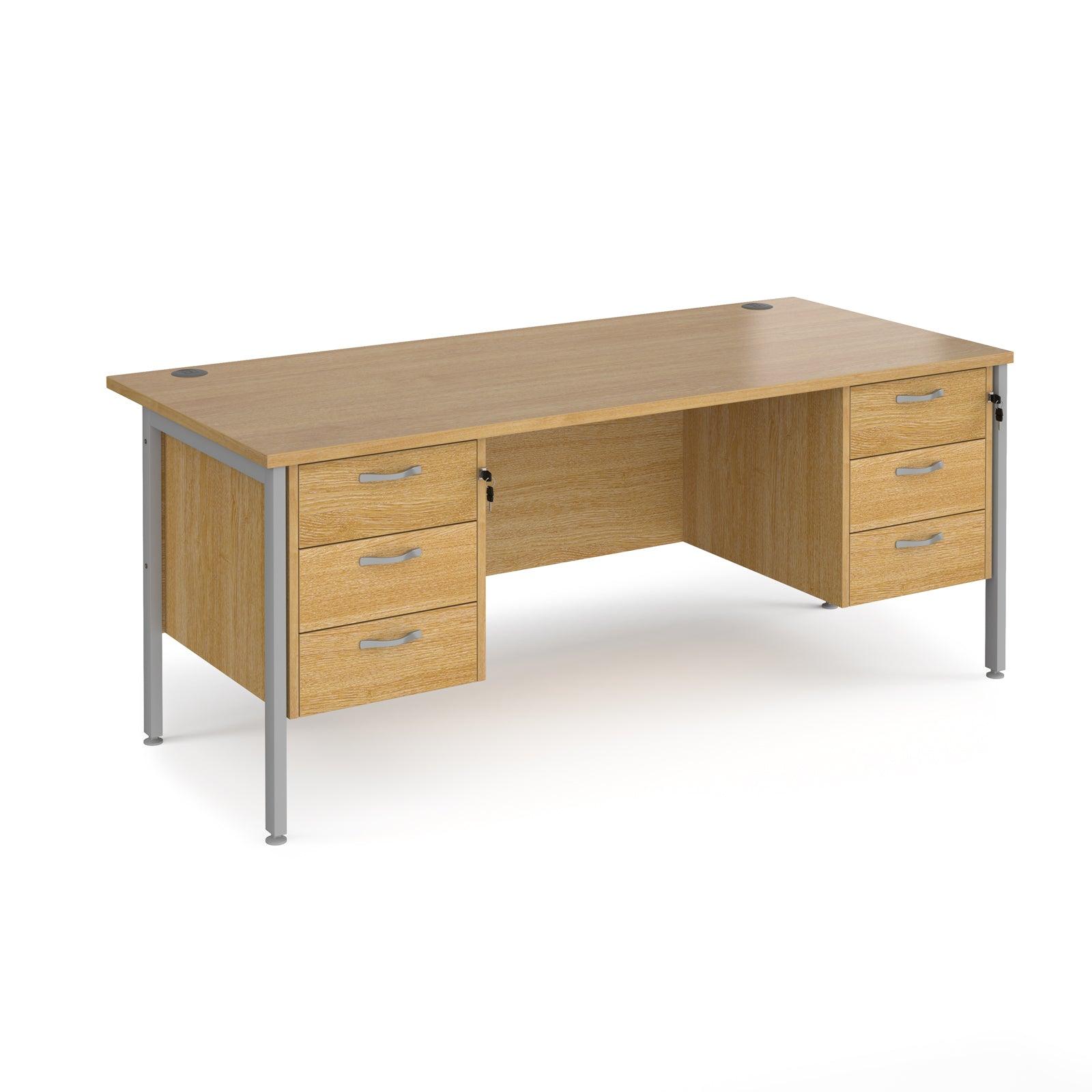 a wooden desk with two drawers and a metal frame