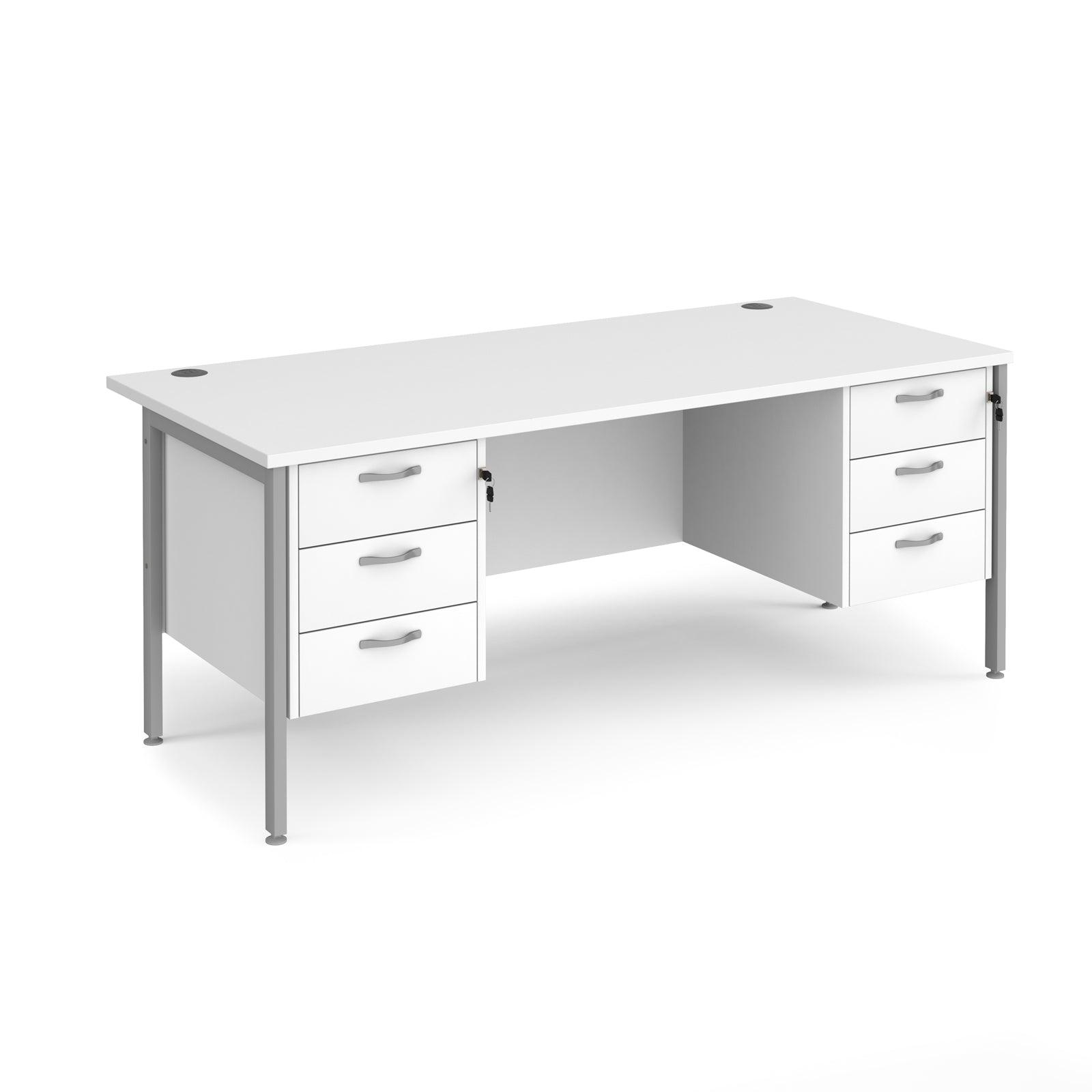 a white desk with three drawers and a white top