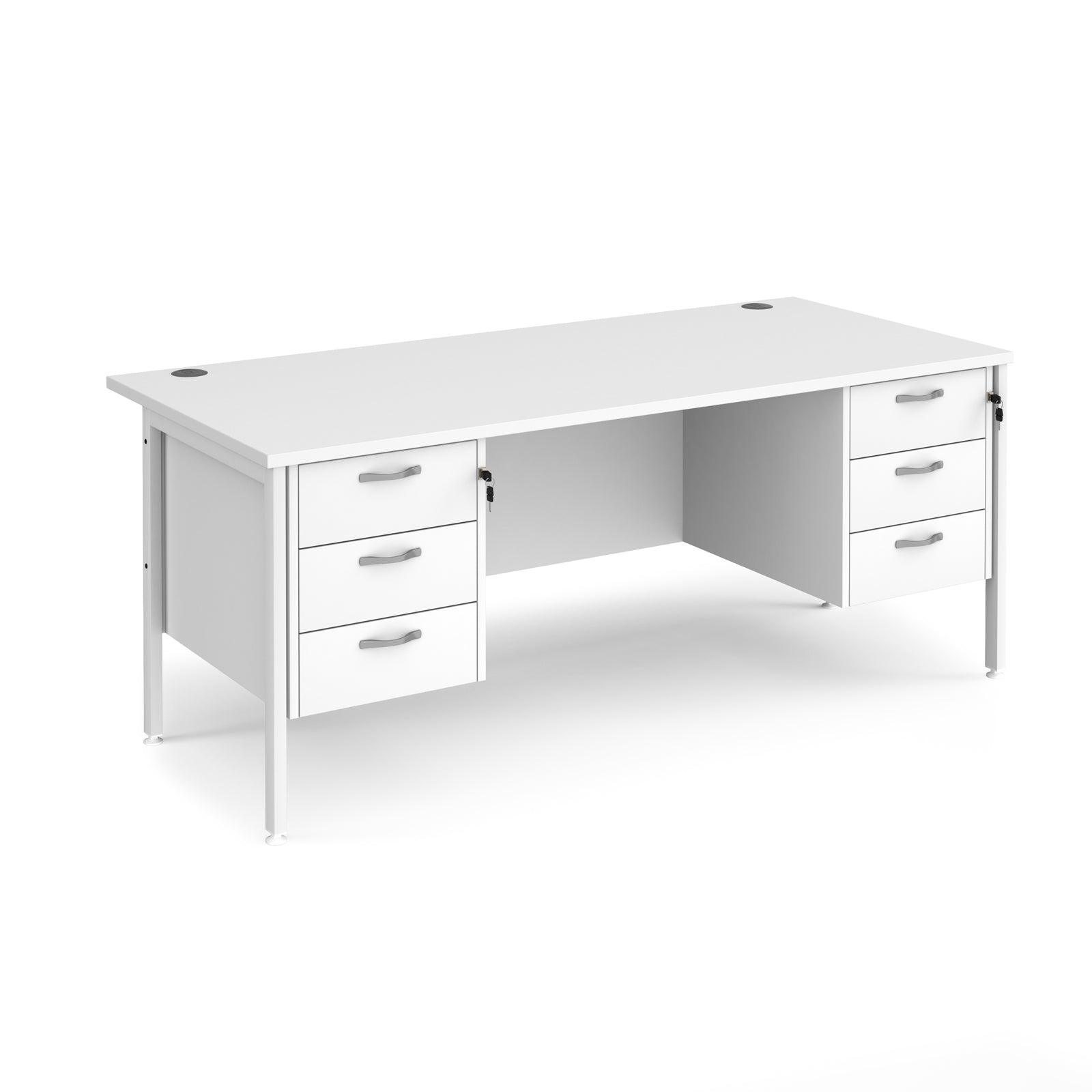 a white desk with three drawers on it