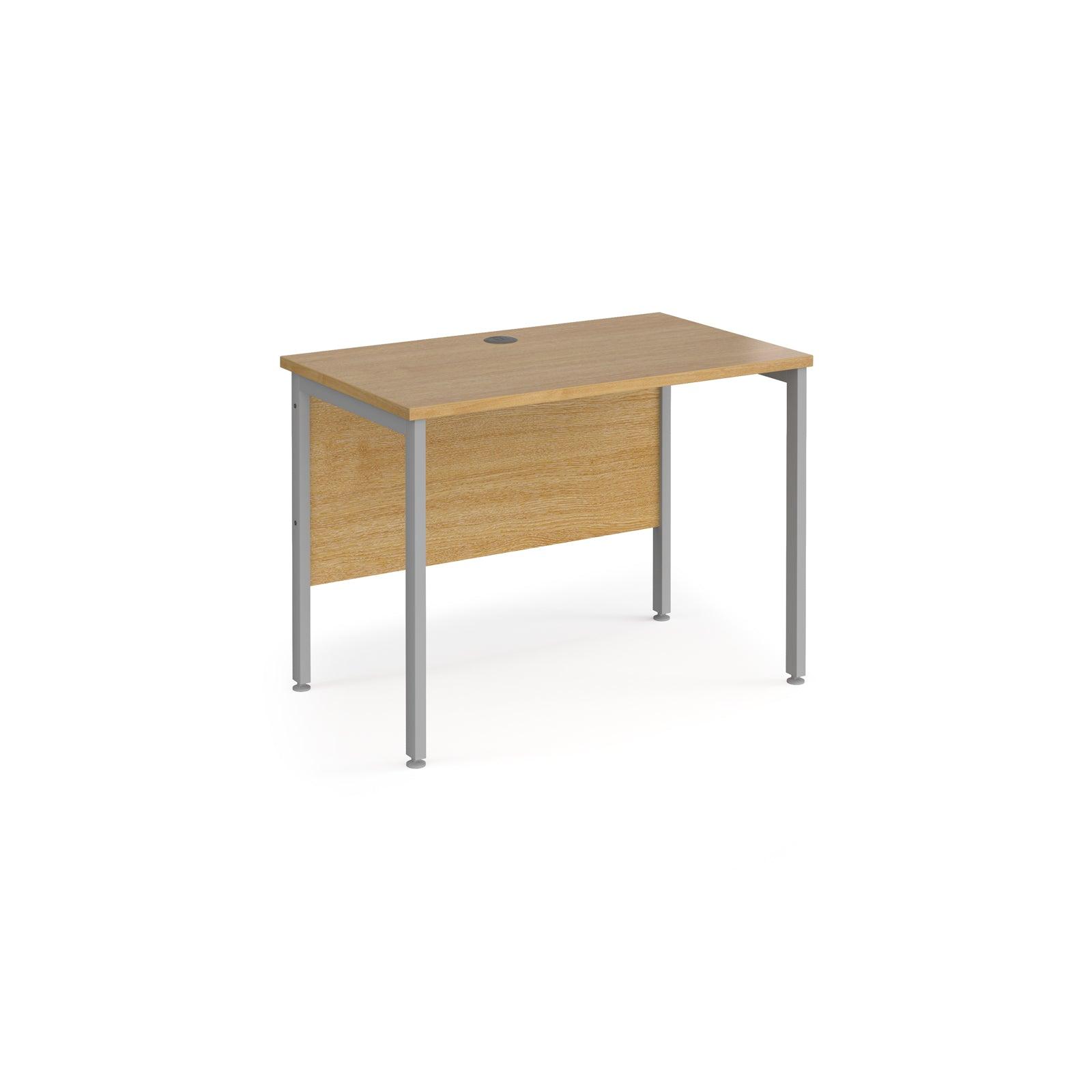 a wooden desk with metal legs on a white background