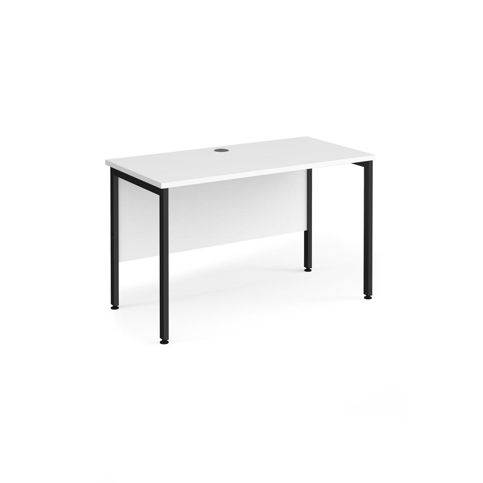 a white desk with black legs on a white background