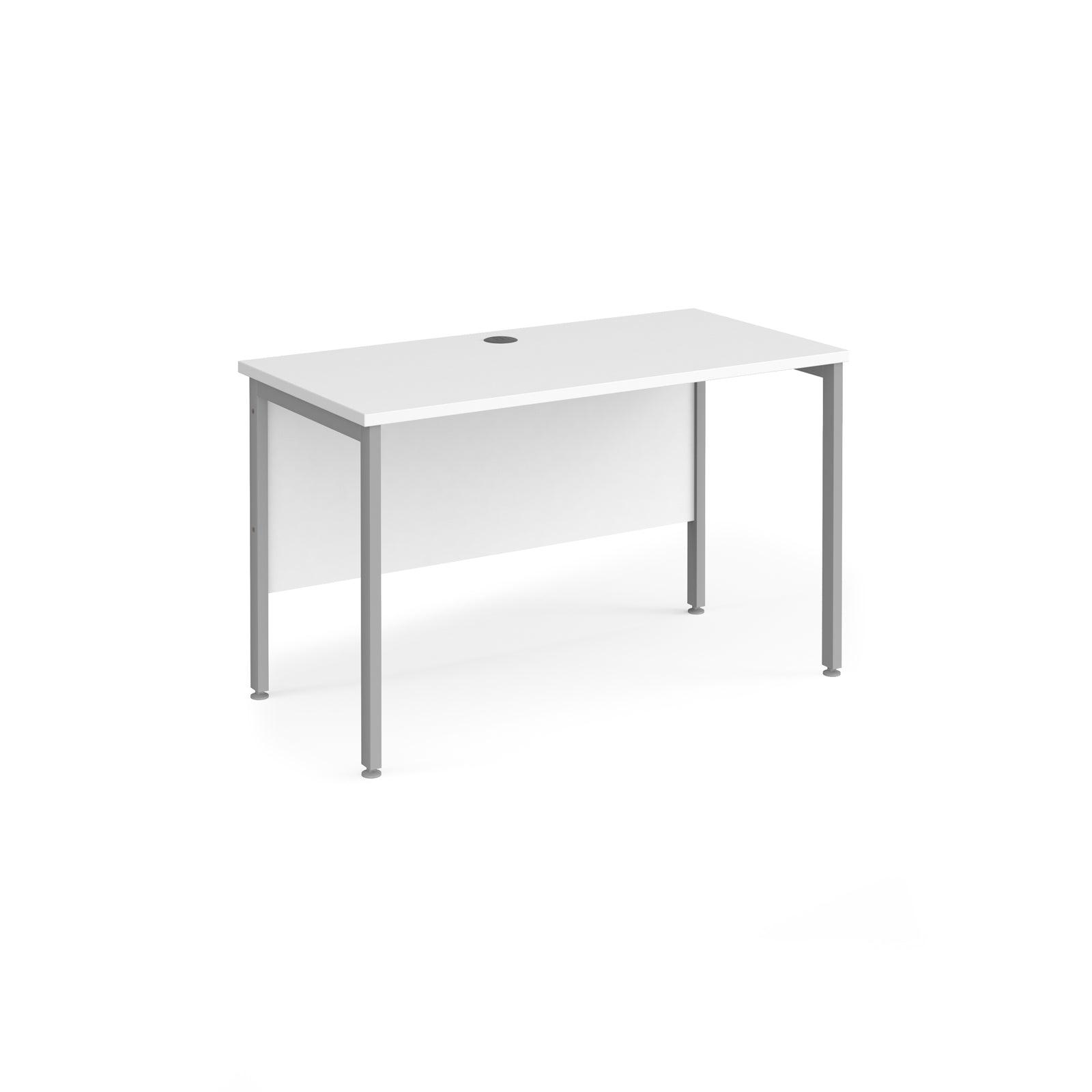 a desk with a white top and silver legs