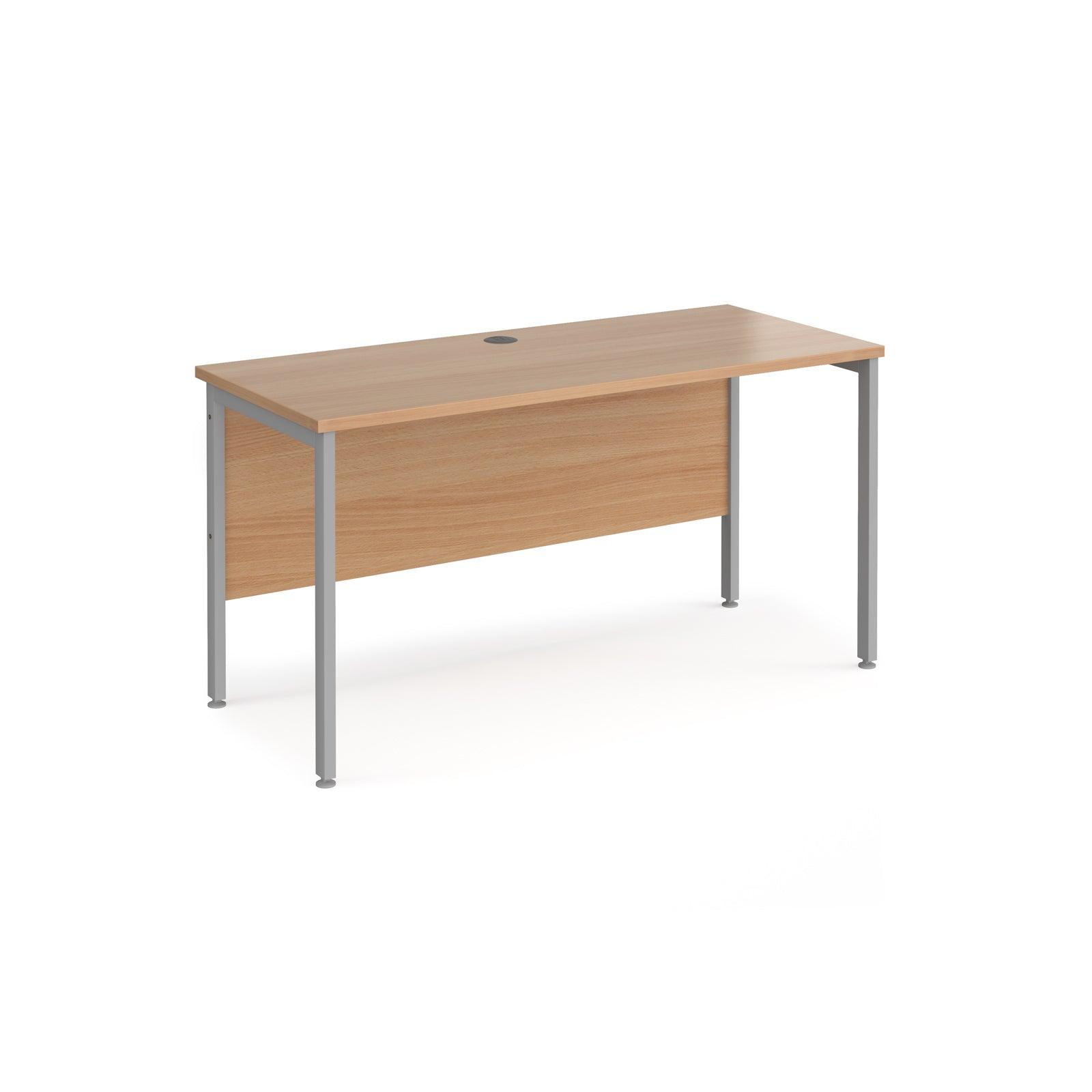 a wooden desk with metal legs on a white background