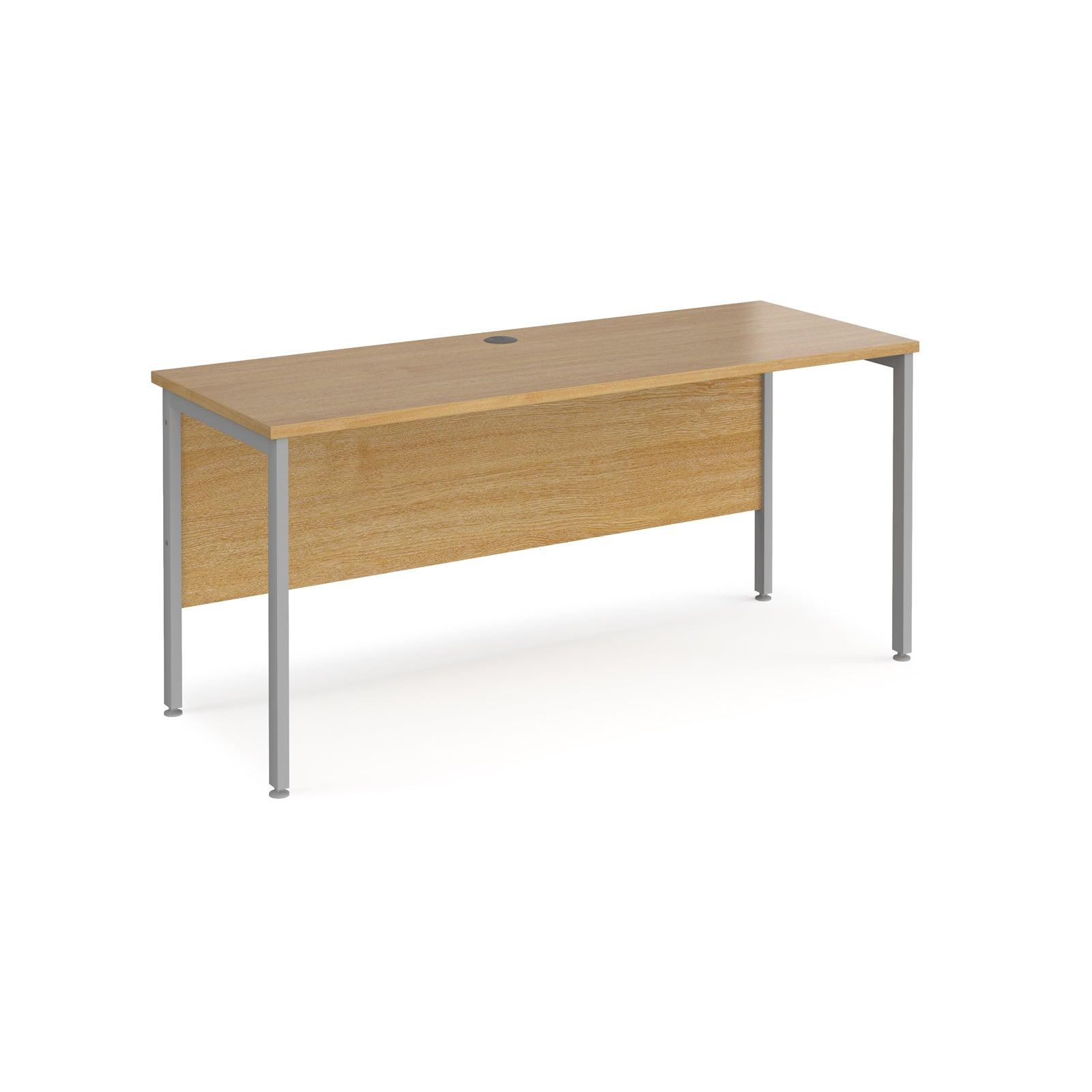 a wooden desk with metal legs on a white background