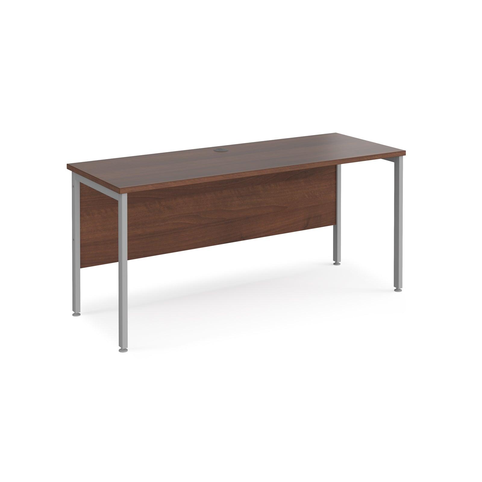 a wooden desk with metal legs on a white background