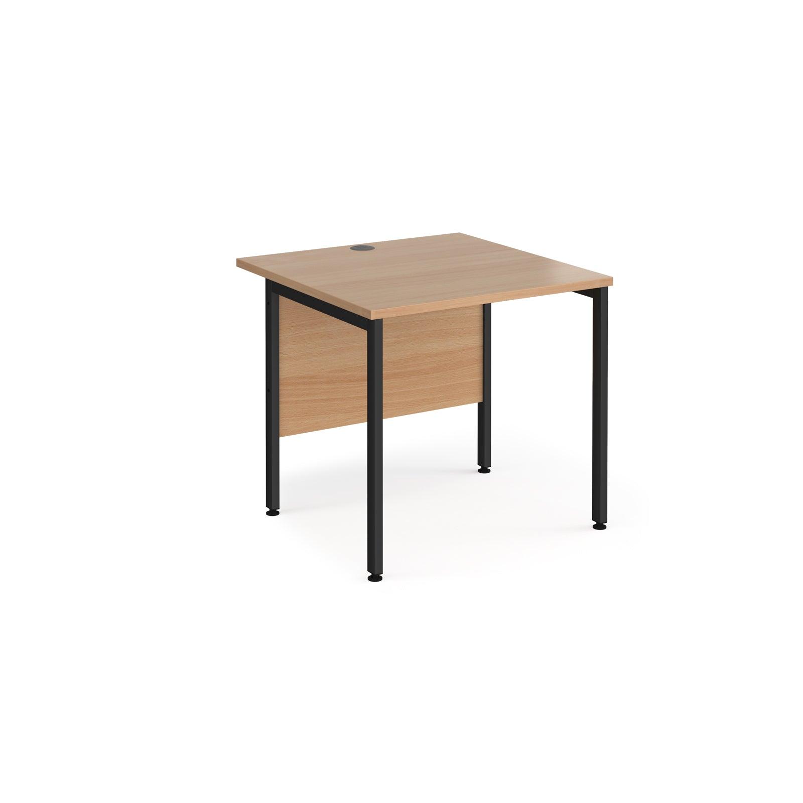 a desk with a wooden top and black legs