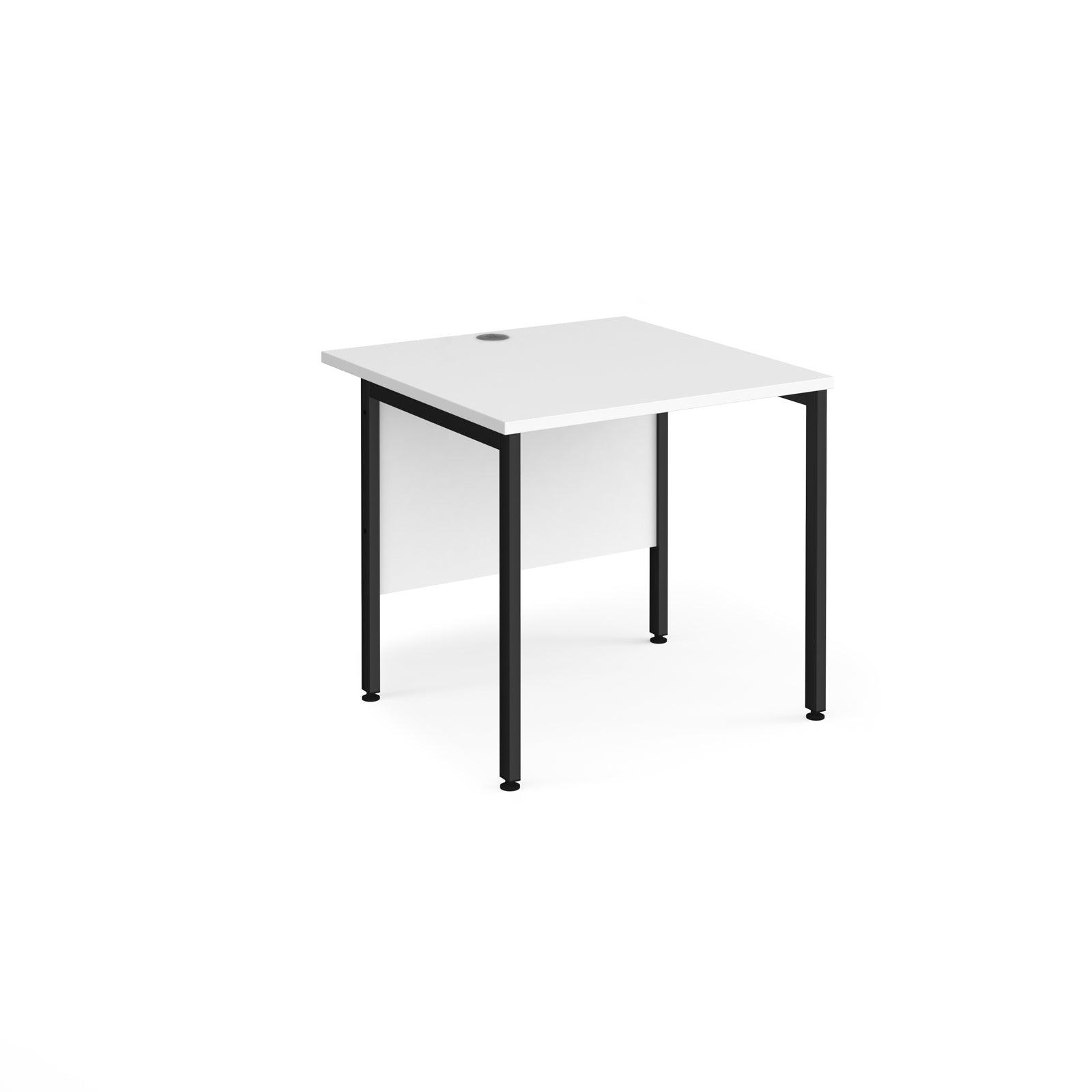 a white table with black legs on a white background