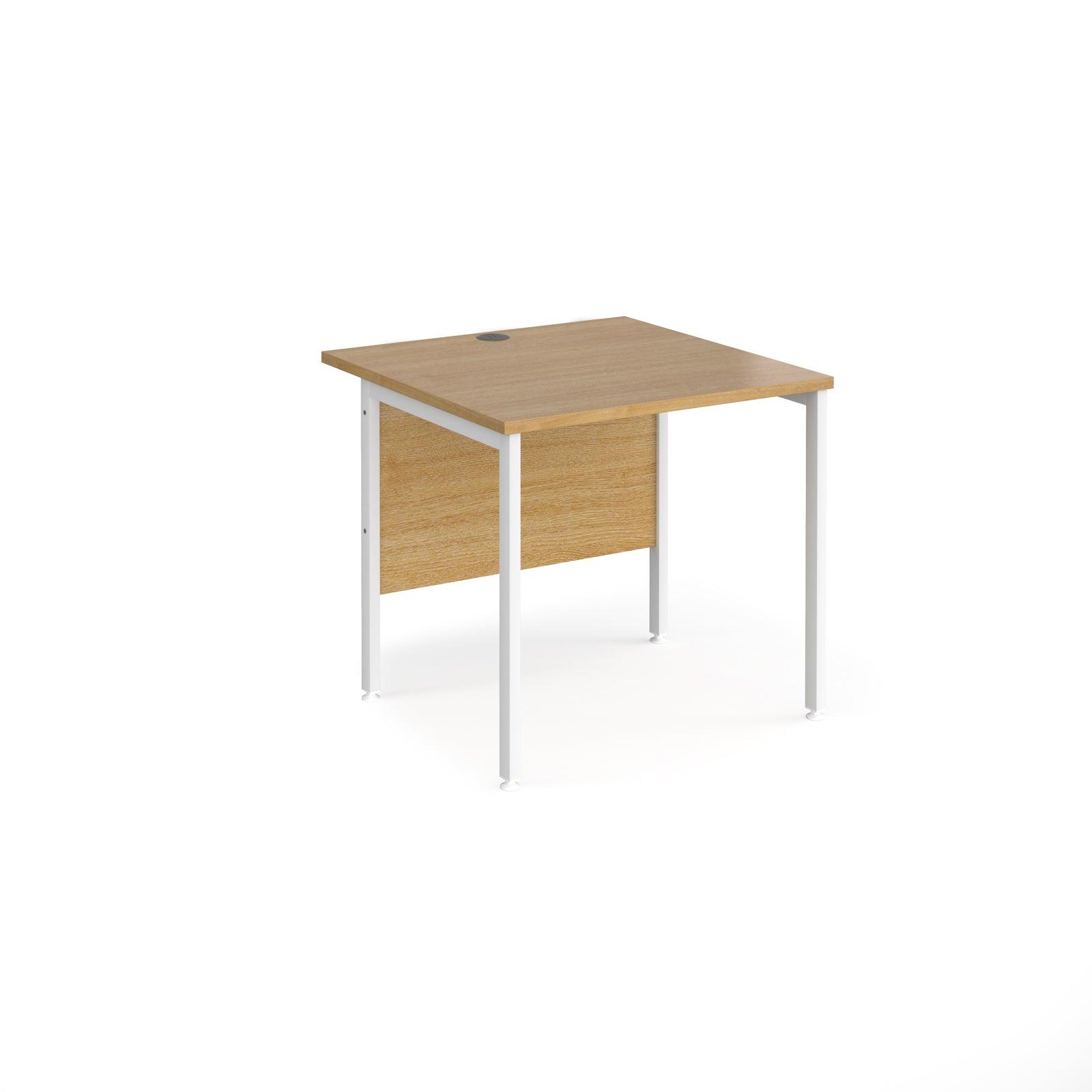 a desk with a wooden top and white legs