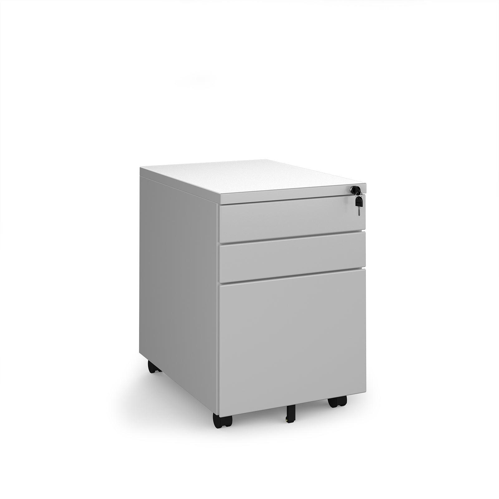 a white filing cabinet sitting on top of a white floor