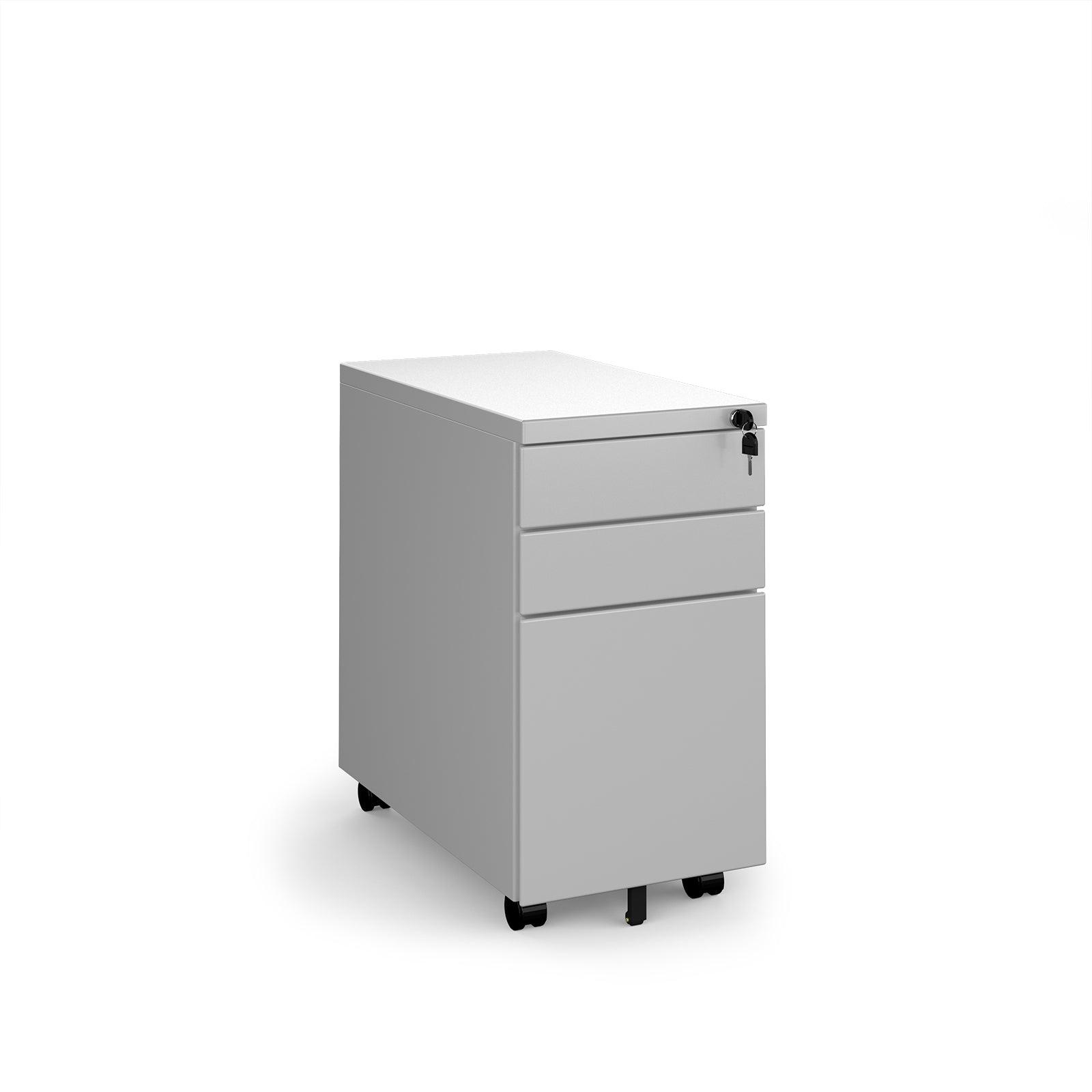 a white filing cabinet sitting on top of a white floor