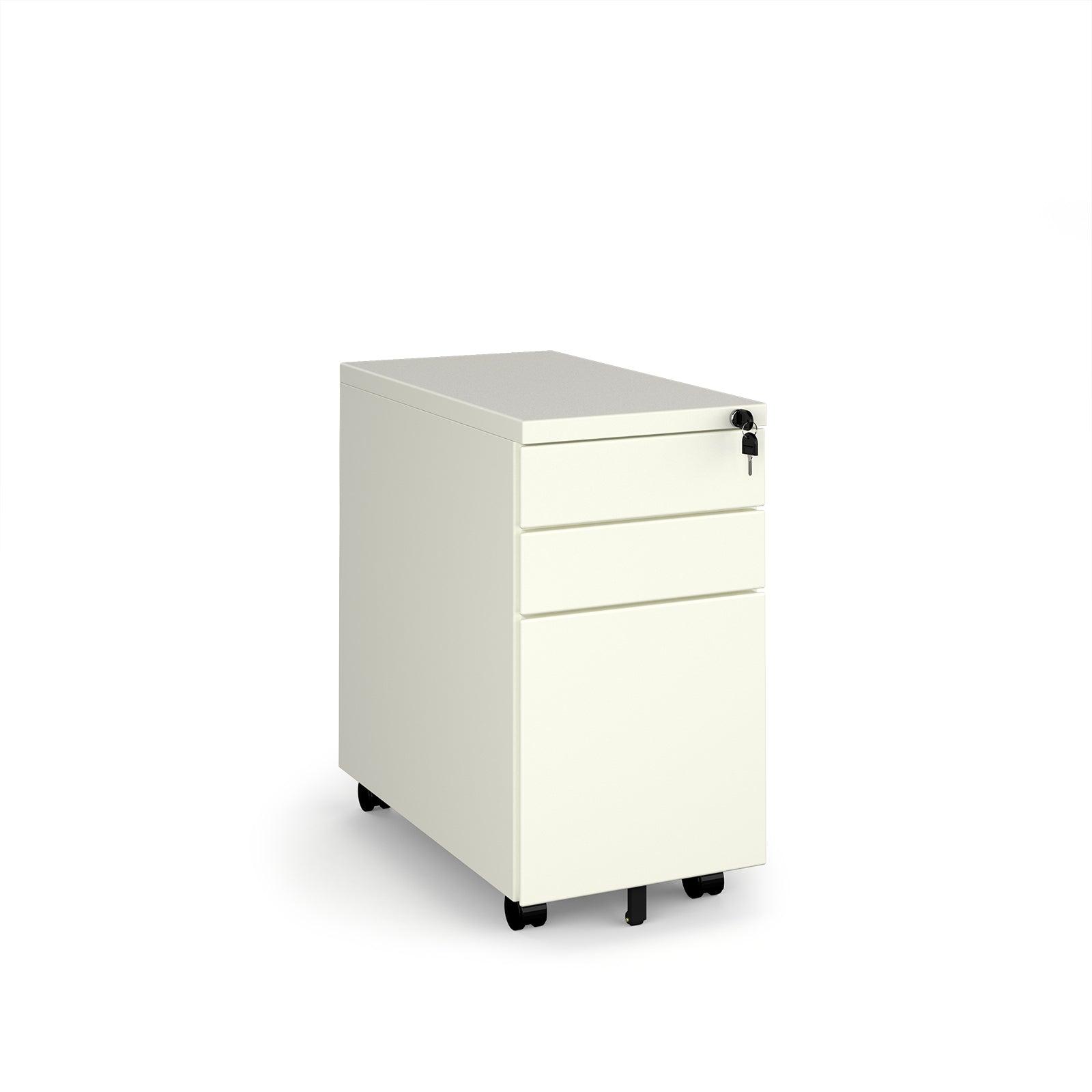 a white filing cabinet sitting on top of a white floor