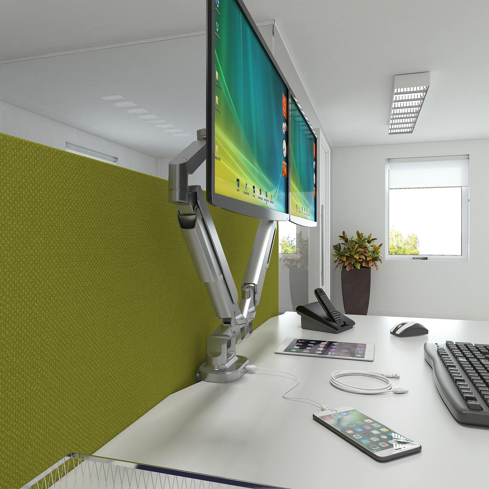 a computer monitor sitting on top of a white desk