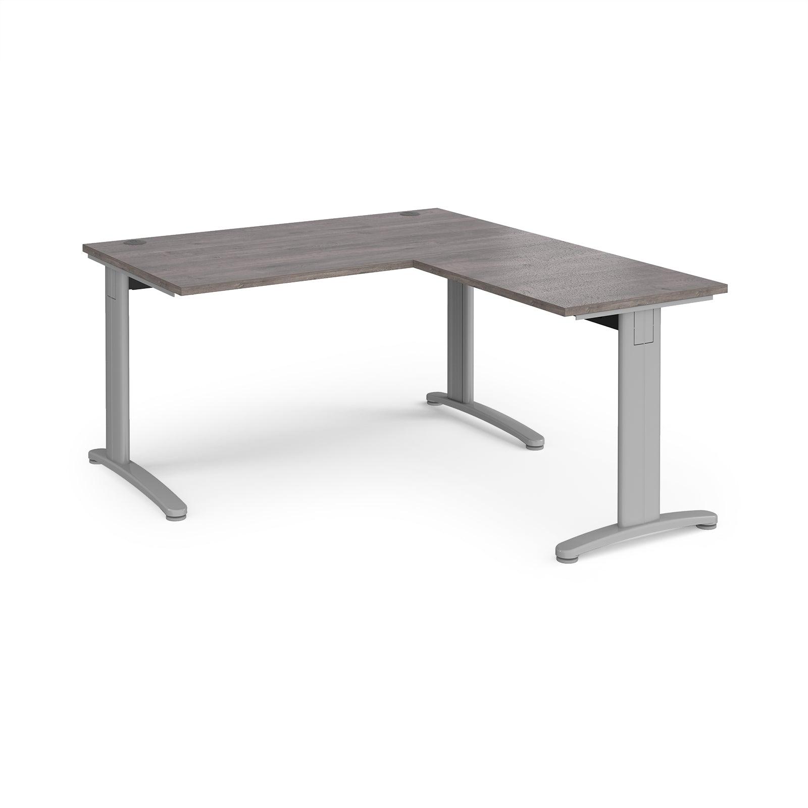 a desk with a grey top and silver legs