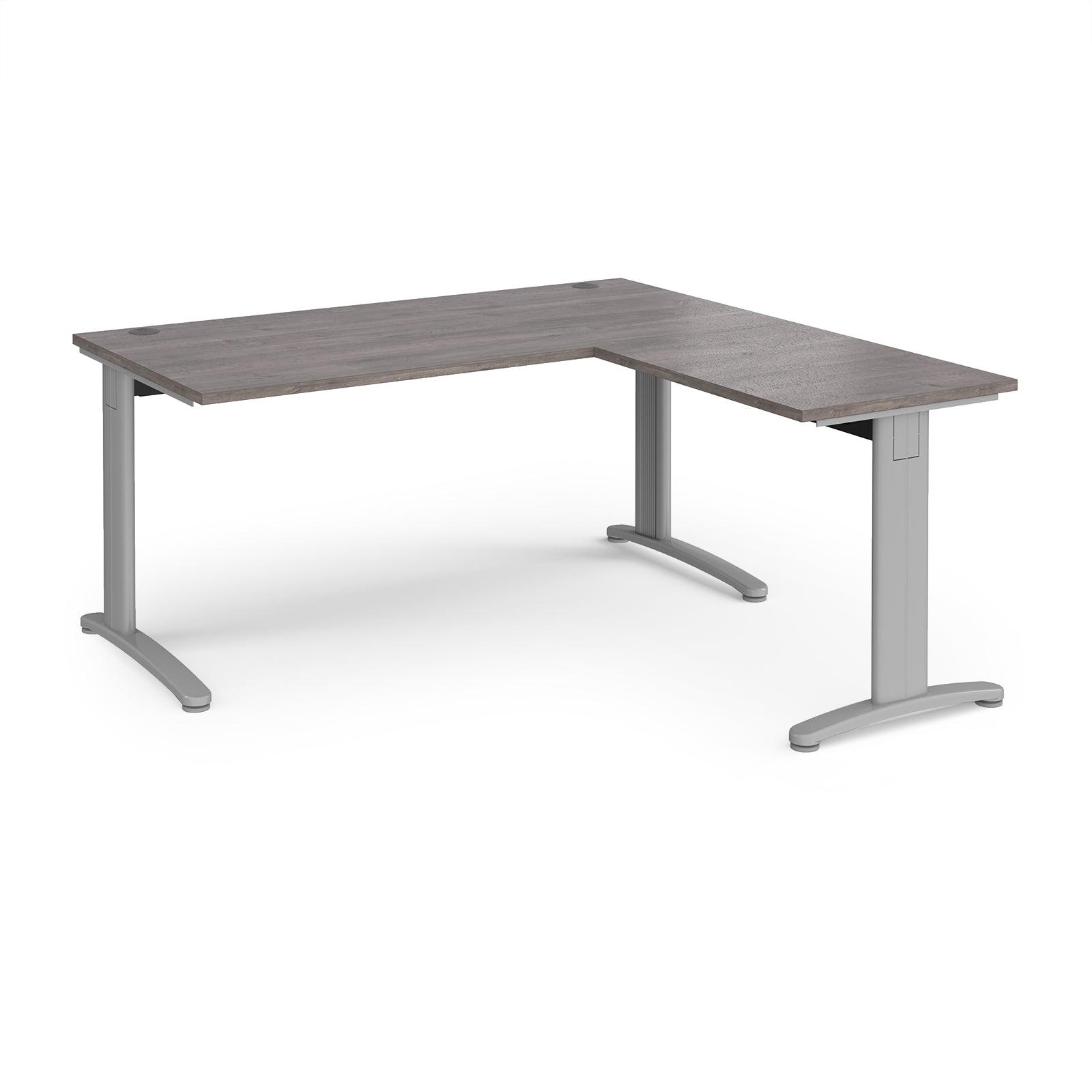 a desk with a grey top and silver legs