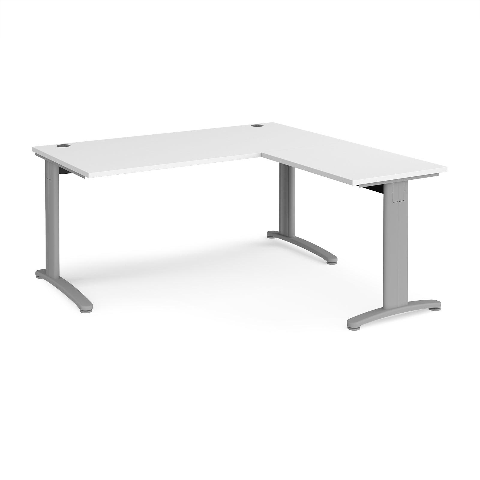 a white desk with a silver frame