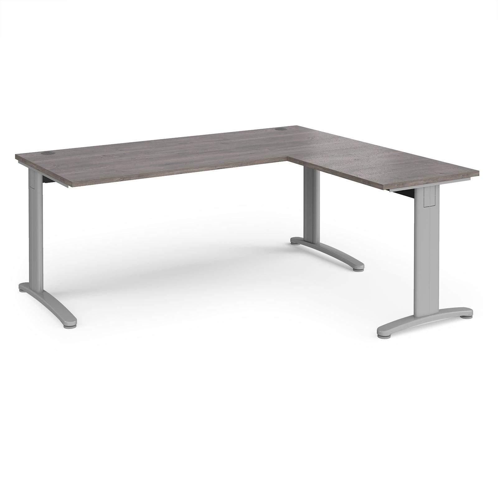 a desk with a grey top and silver legs